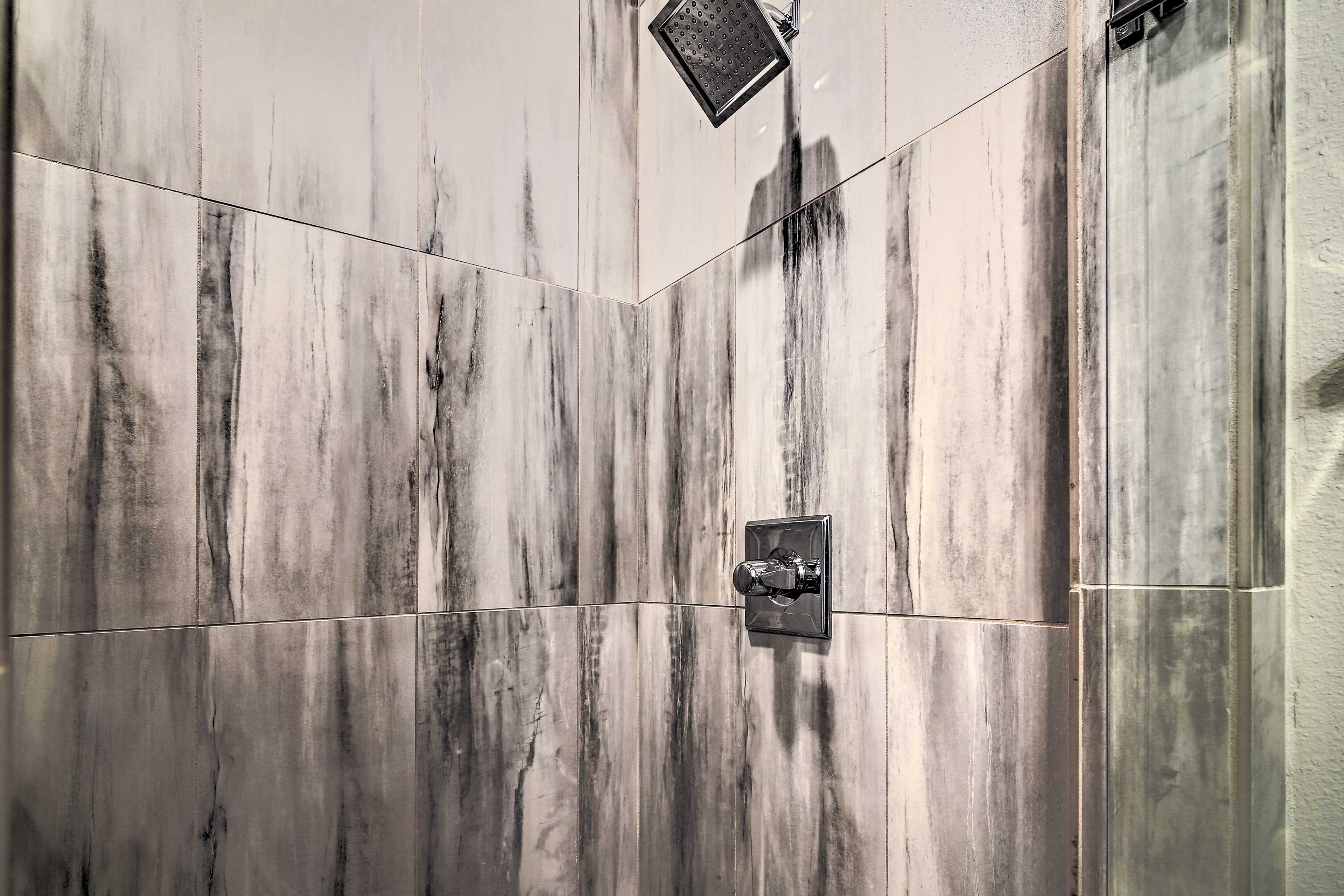 Rinse away the day in the tile-lined shower.