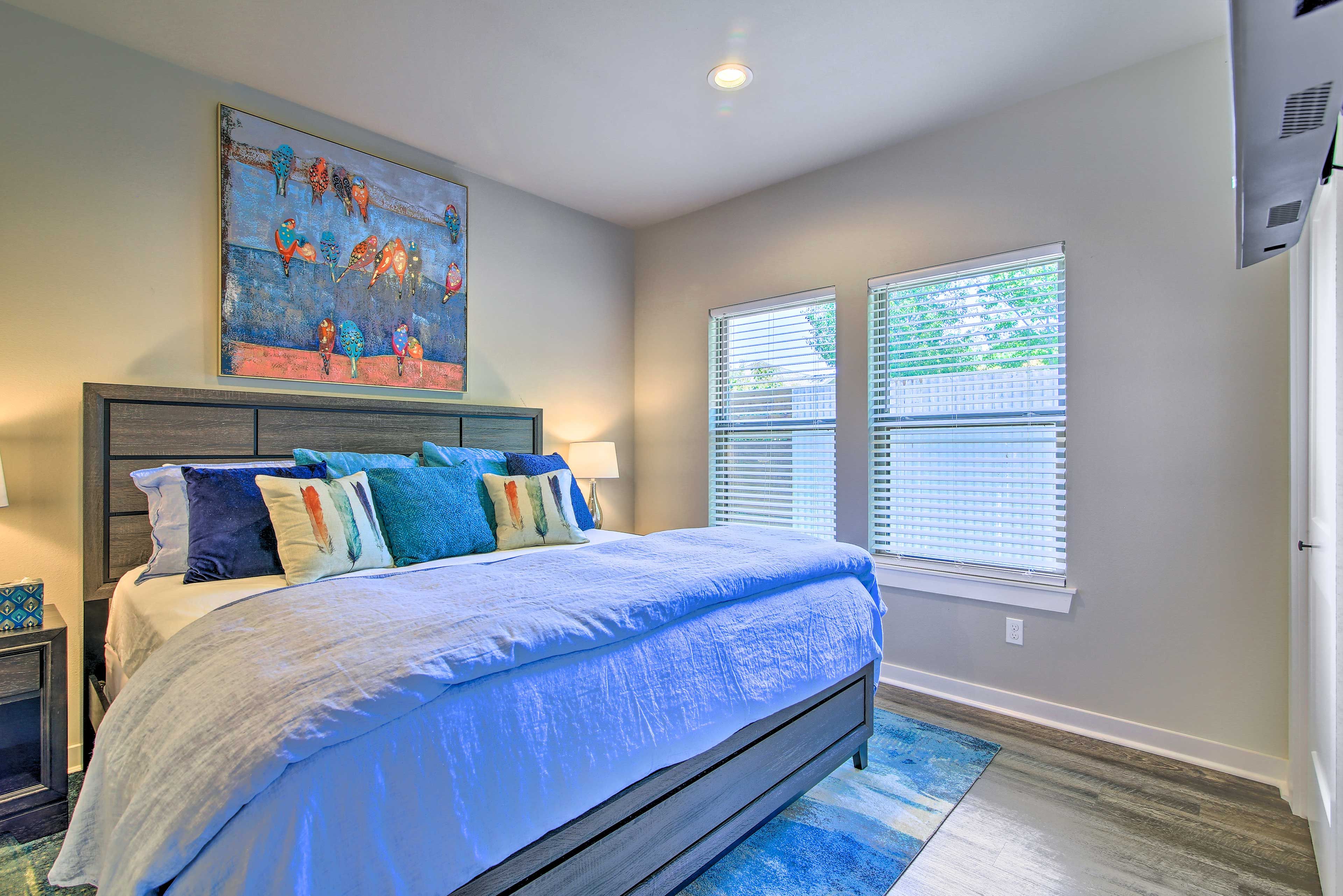 Two guests can sleep comfortably on the king-sized bed in this bedroom.