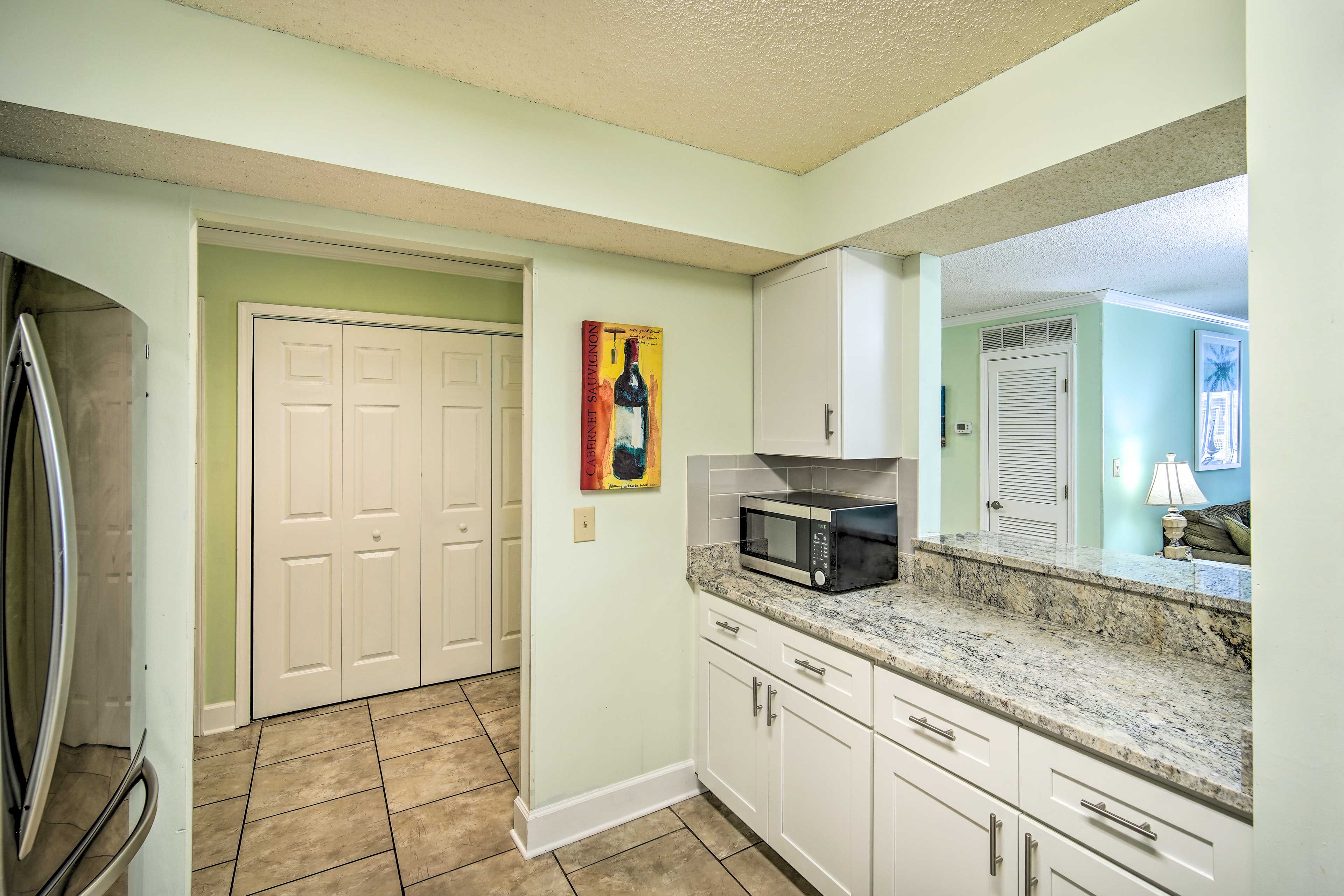 The kitchen has plenty of counter space for meal prep.