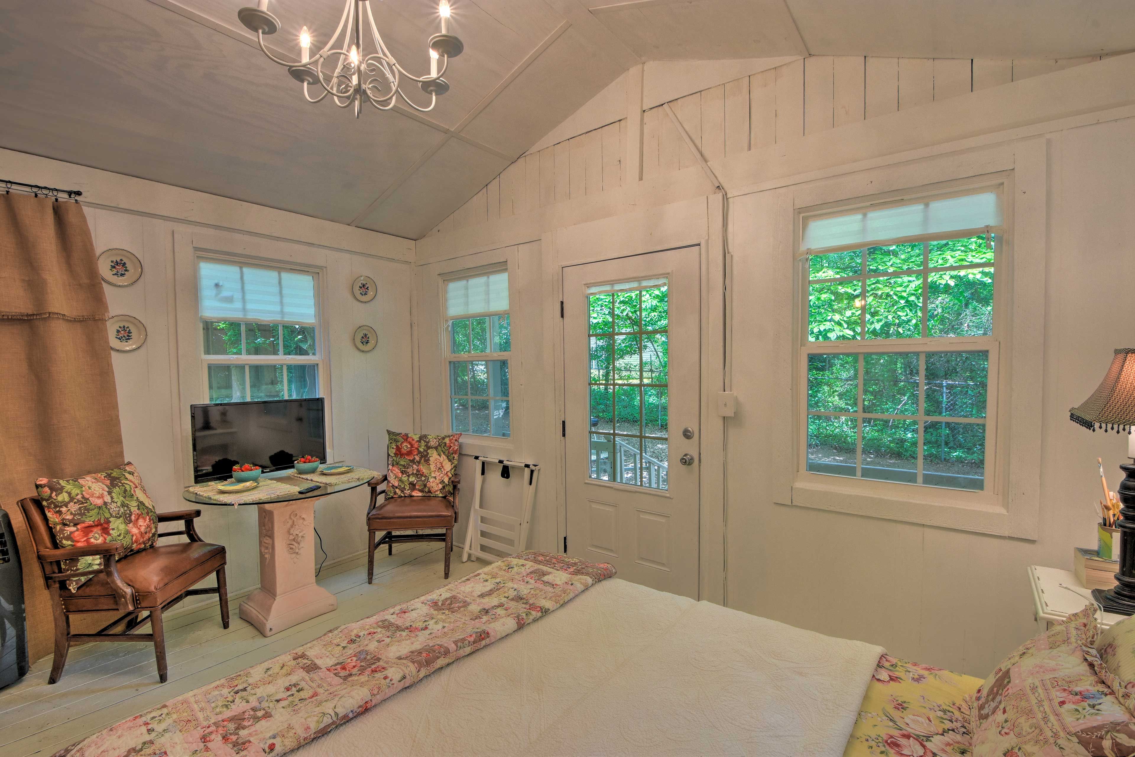 The master bedroom has vaulted ceilings and a Smart TV.