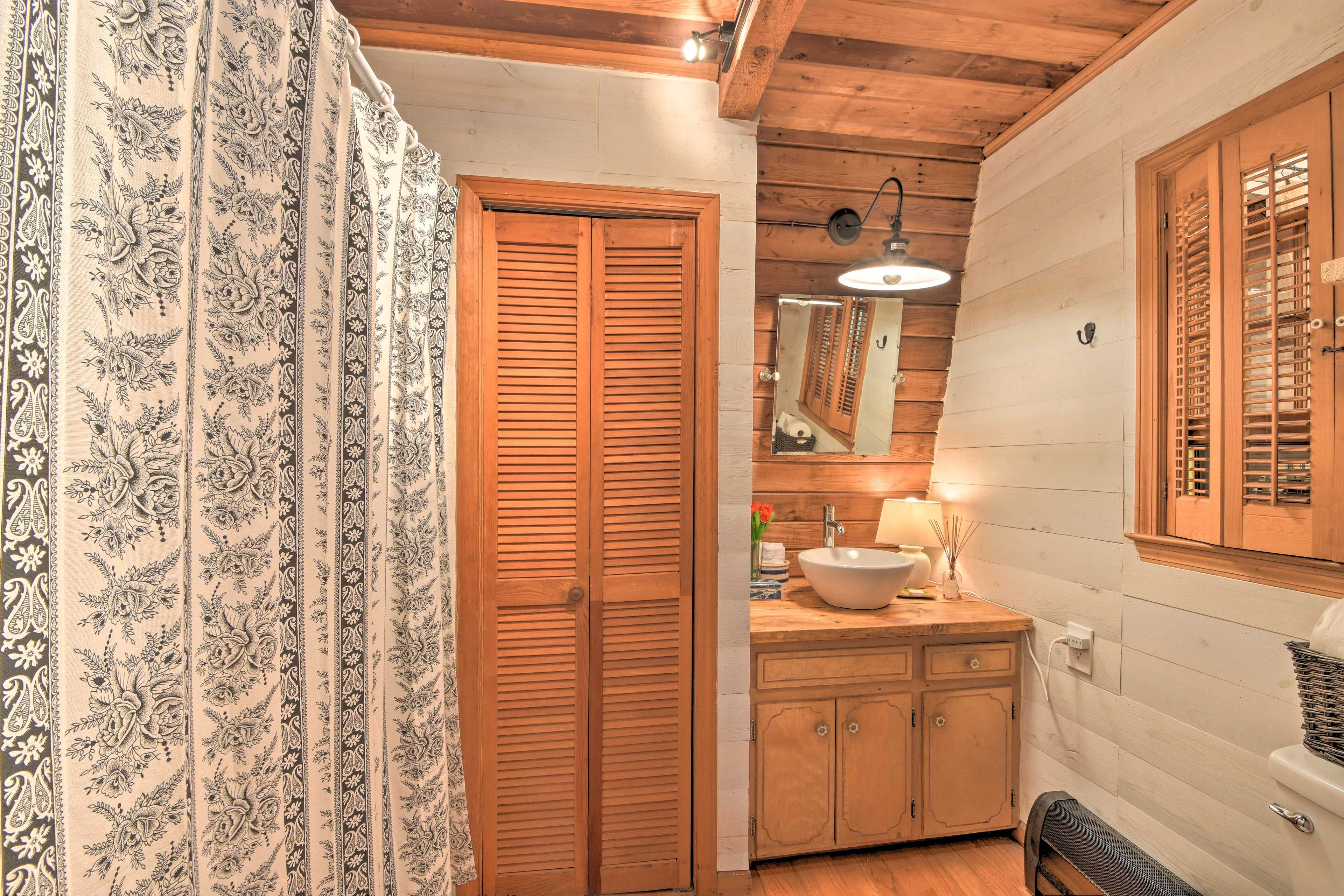 The master bathroom features a basin sink and shower.