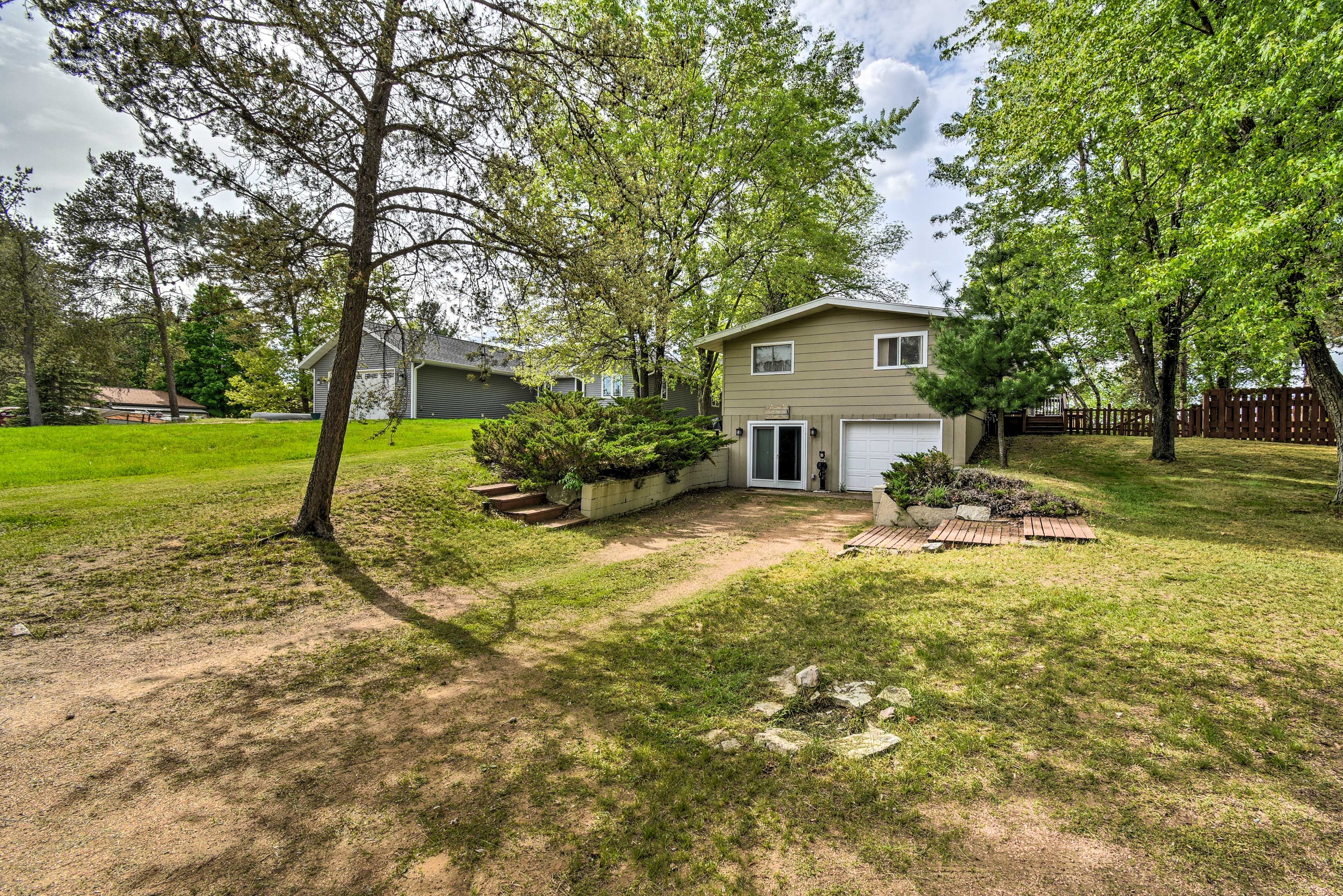 The gravel driveway provides RV and trailer parking.