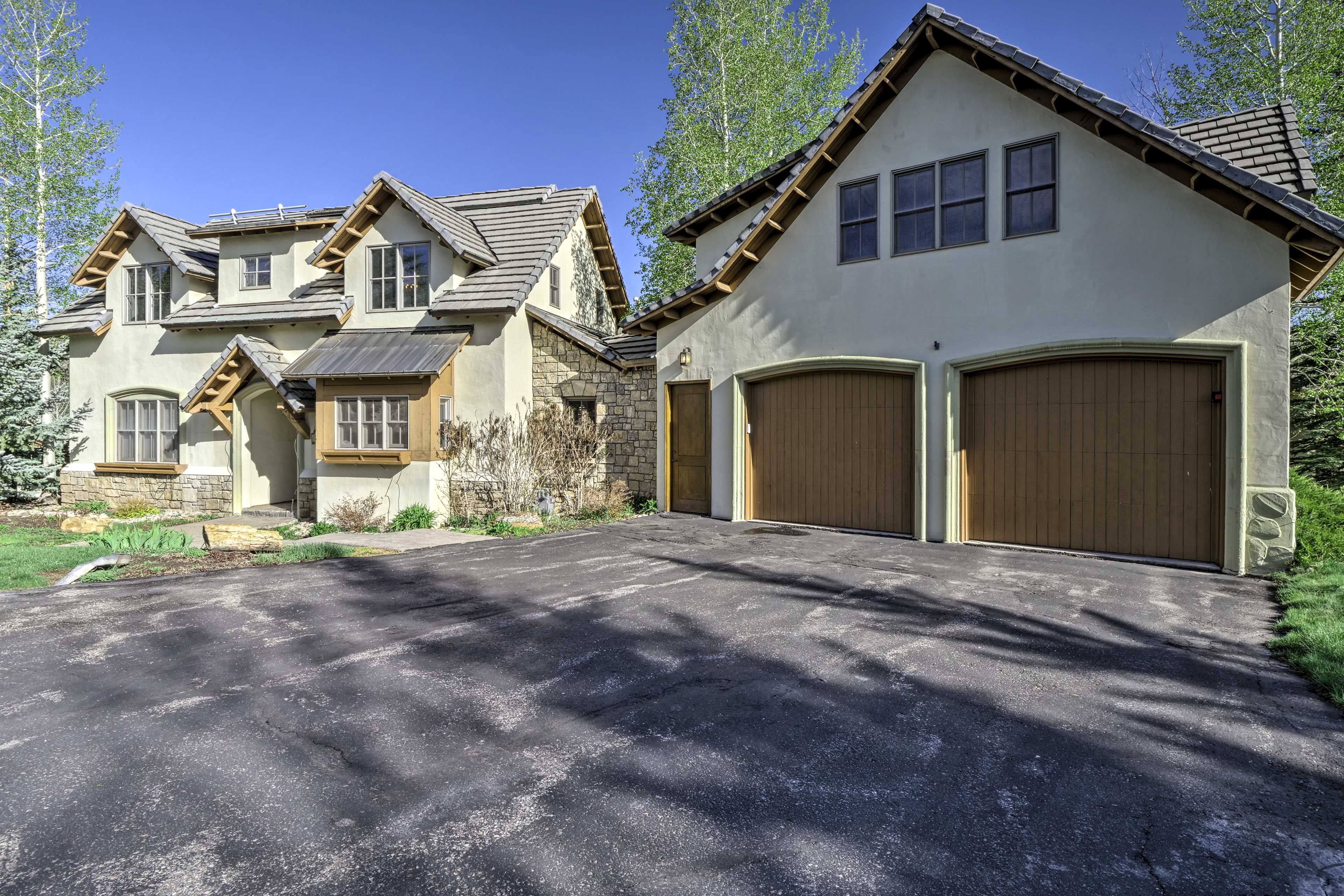 Two vehicles can be parked in the garage and 3 more out in the driveway.