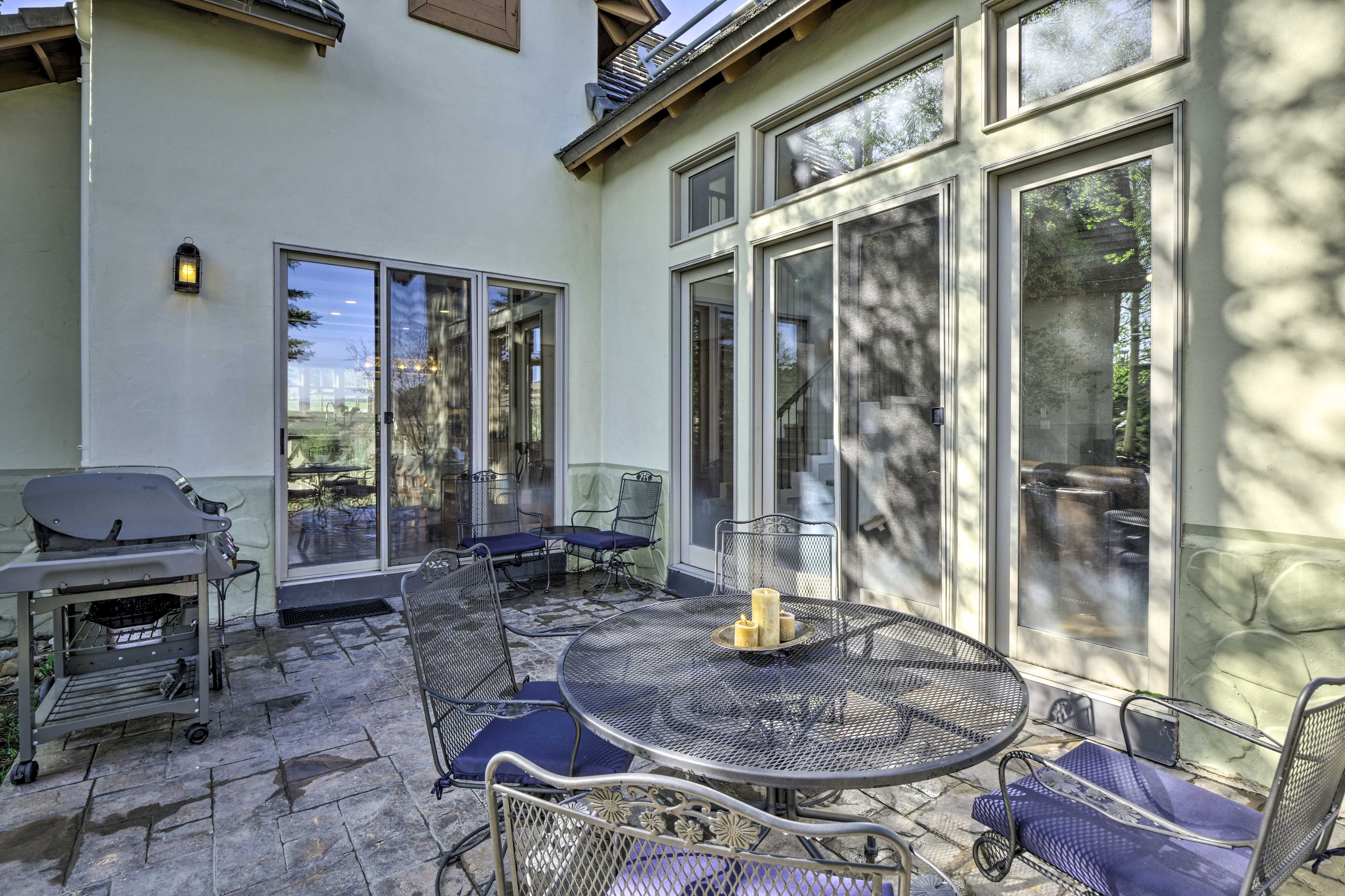 This private outdoor space features a gas grill and patio table.