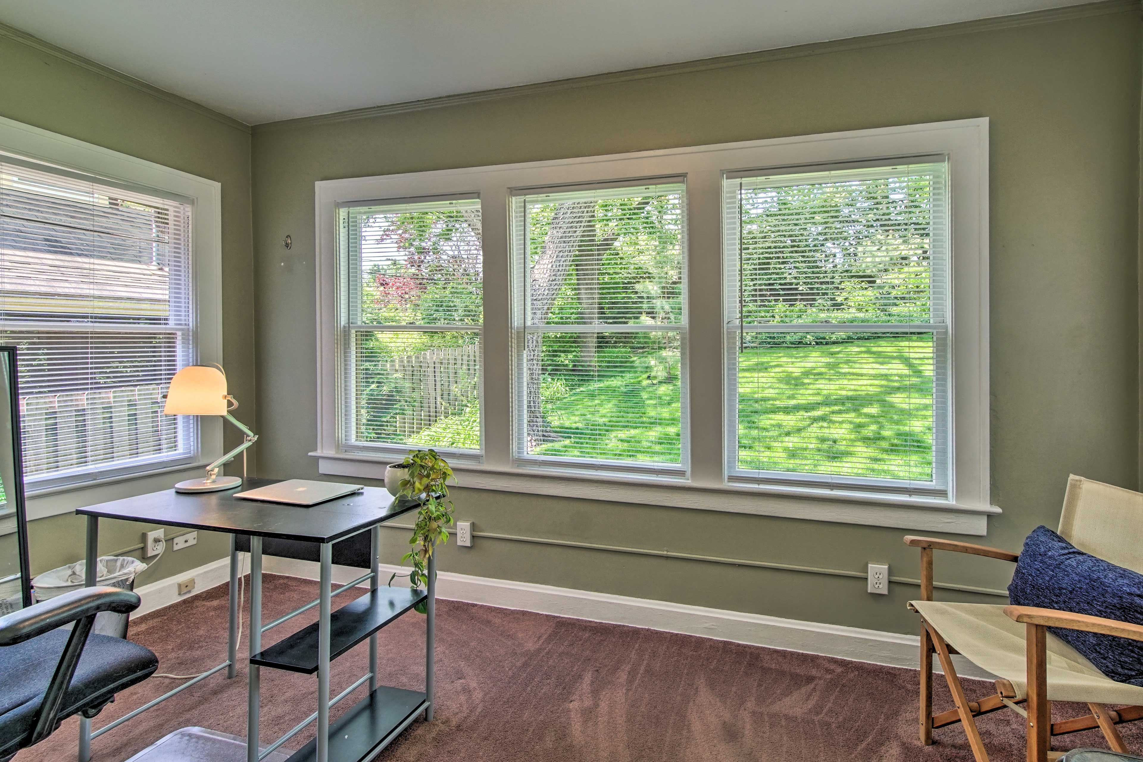 Look out over the sunny backyard while you work.