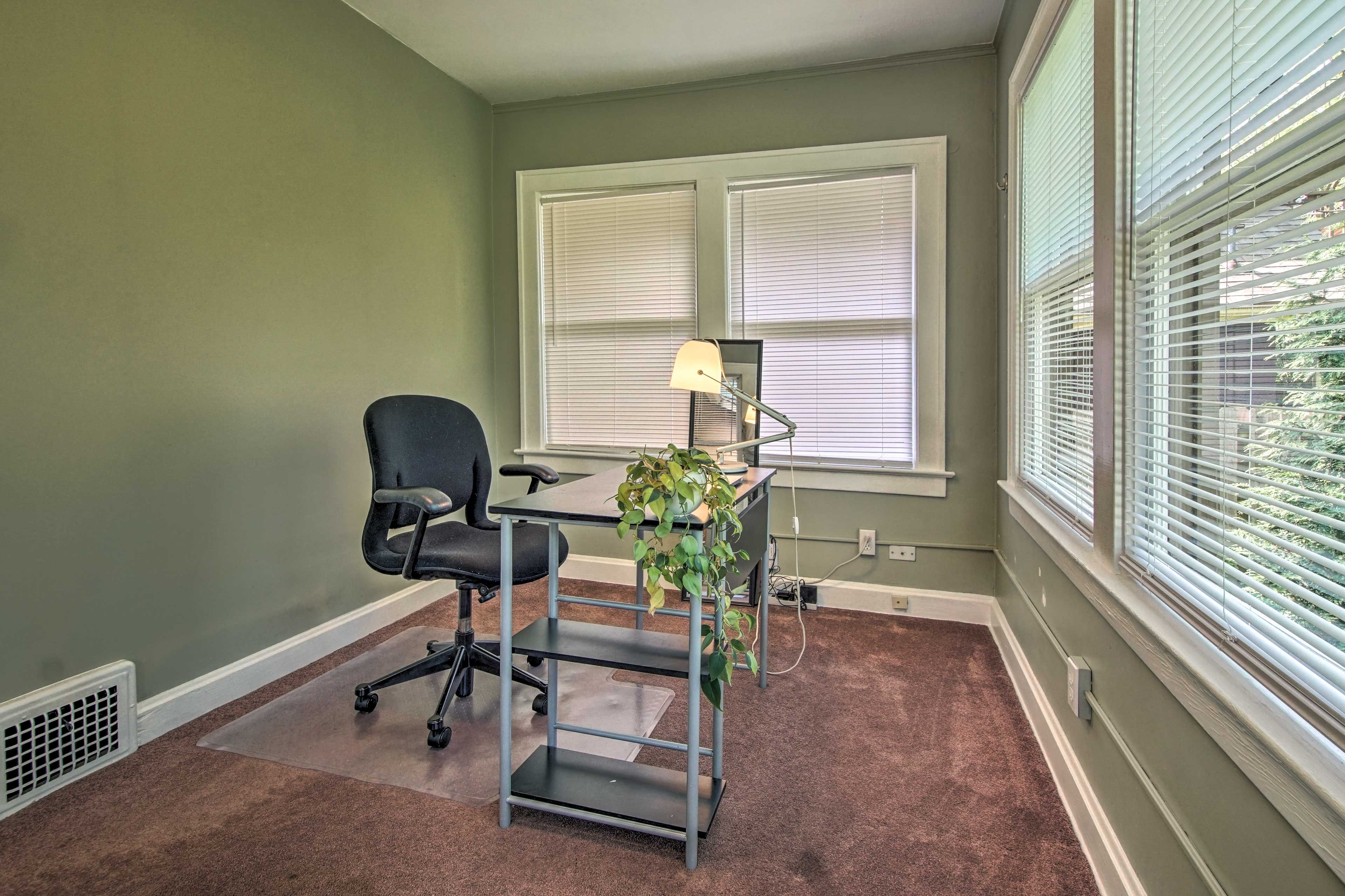 The property also features a home office complete with a desk and an armchair.