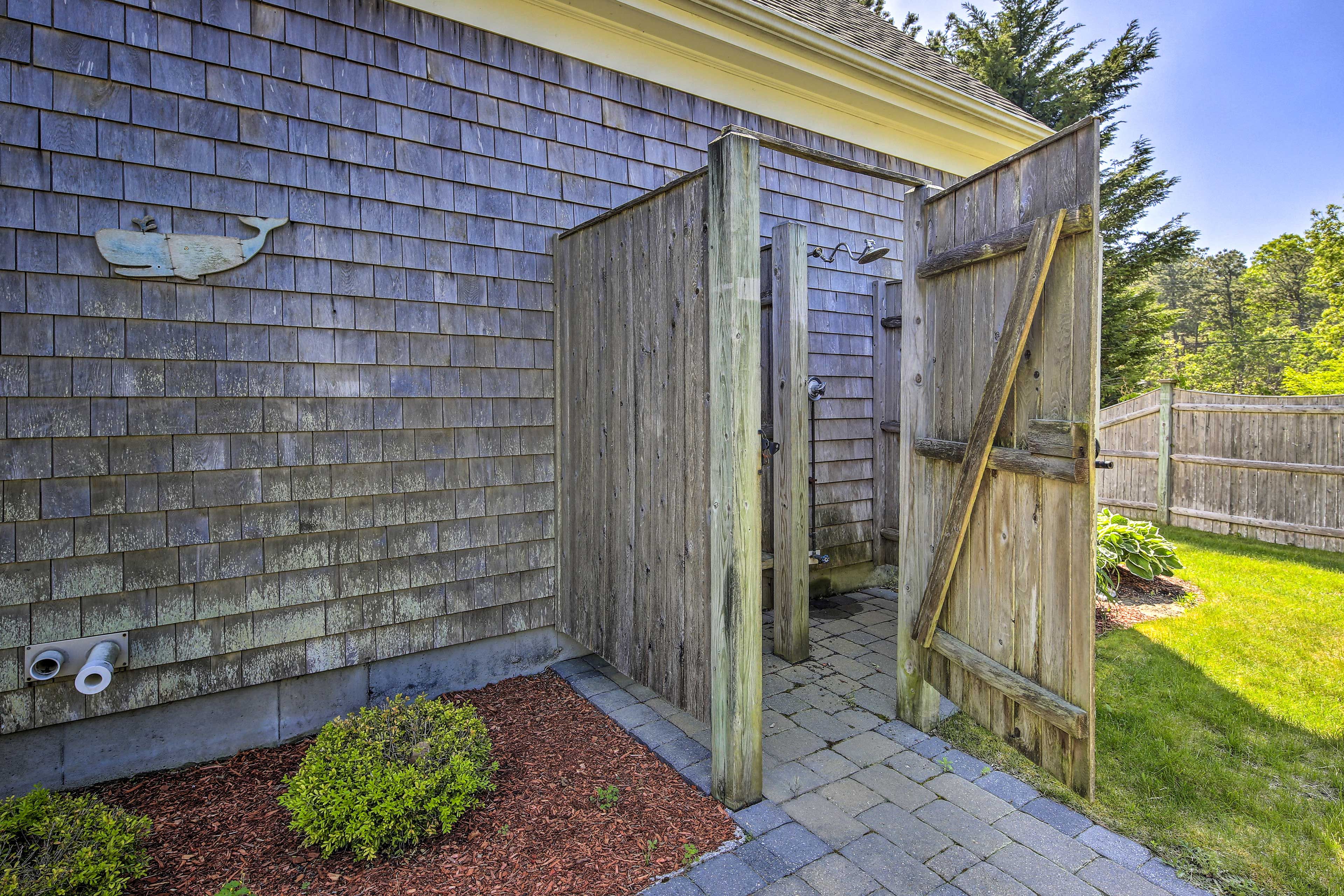 Wash off sand and seawater in the home's outdoor shower.