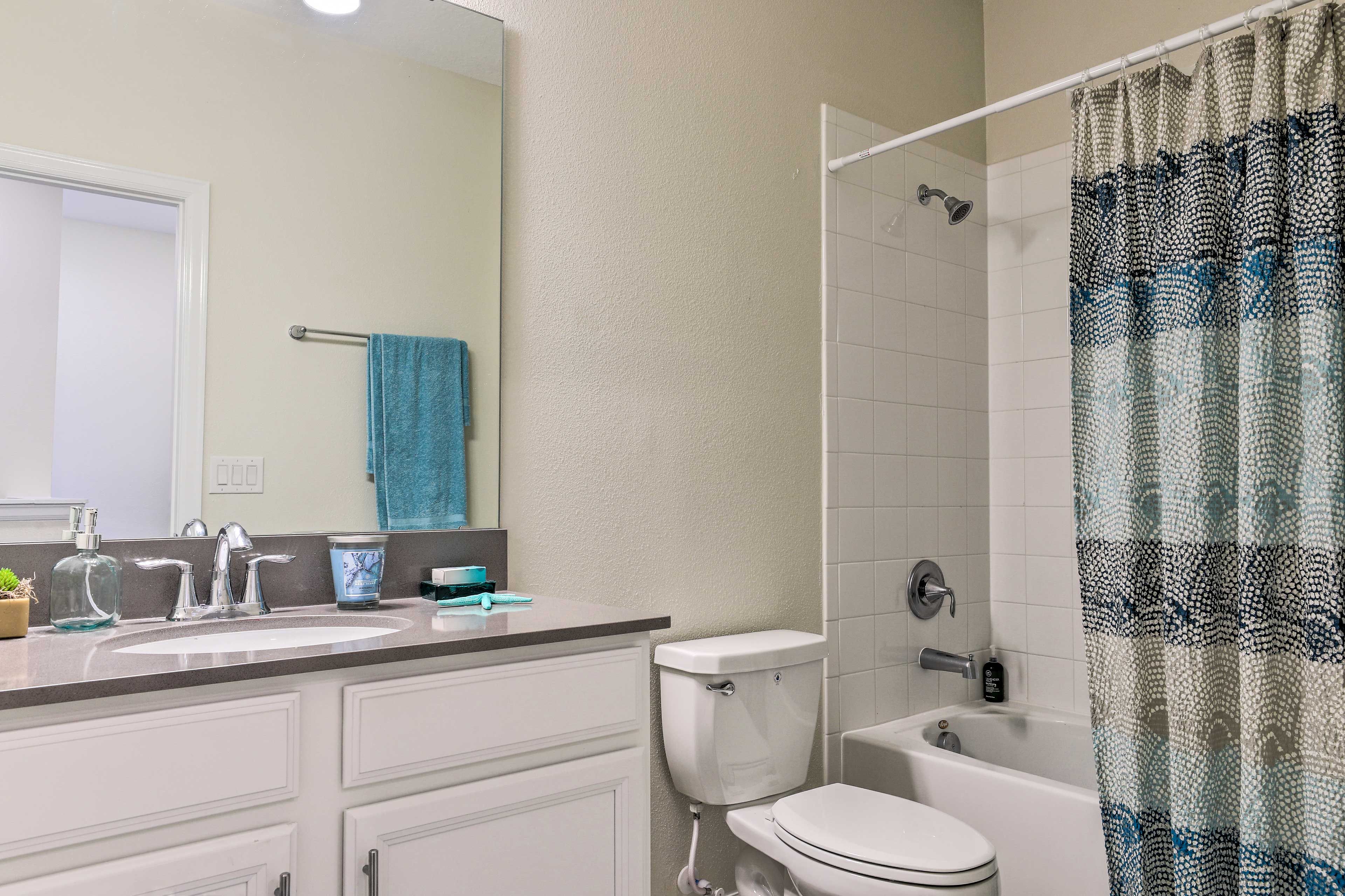 Another full bath is ready for guests.
