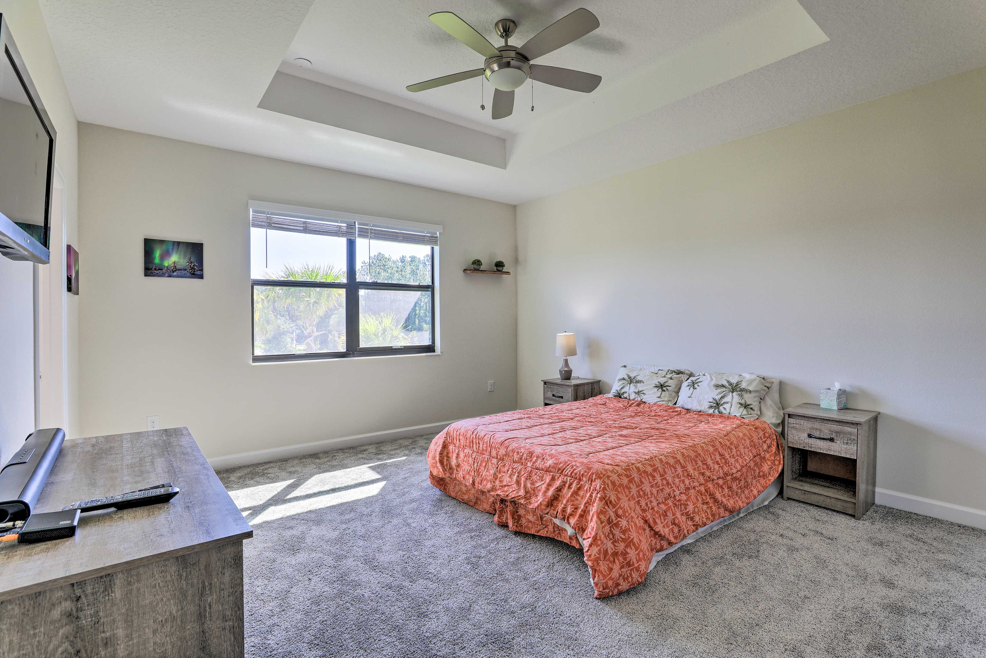 Two guests can claim the queen bed in this bedroom.