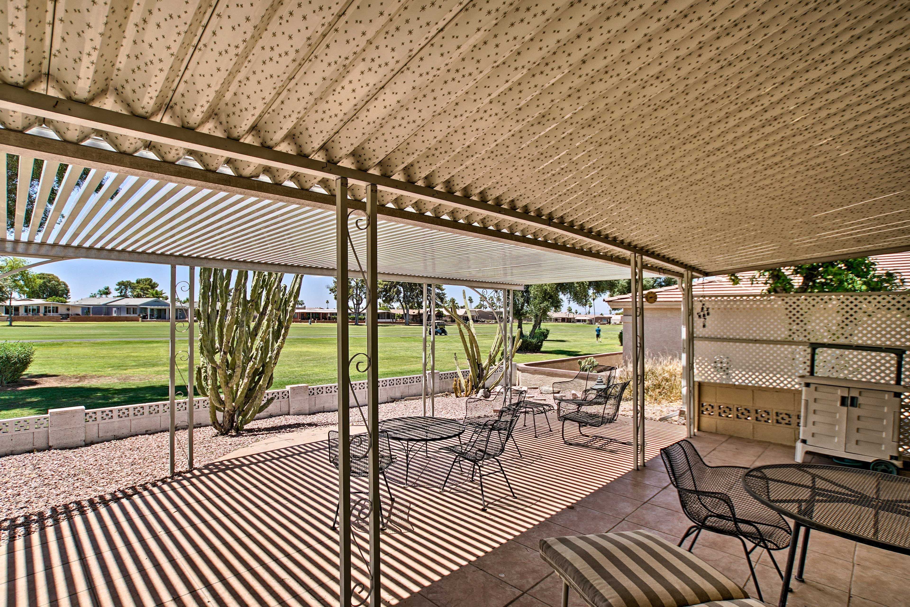 Bring the party to the covered patio to enjoy a cookout by the golf course.
