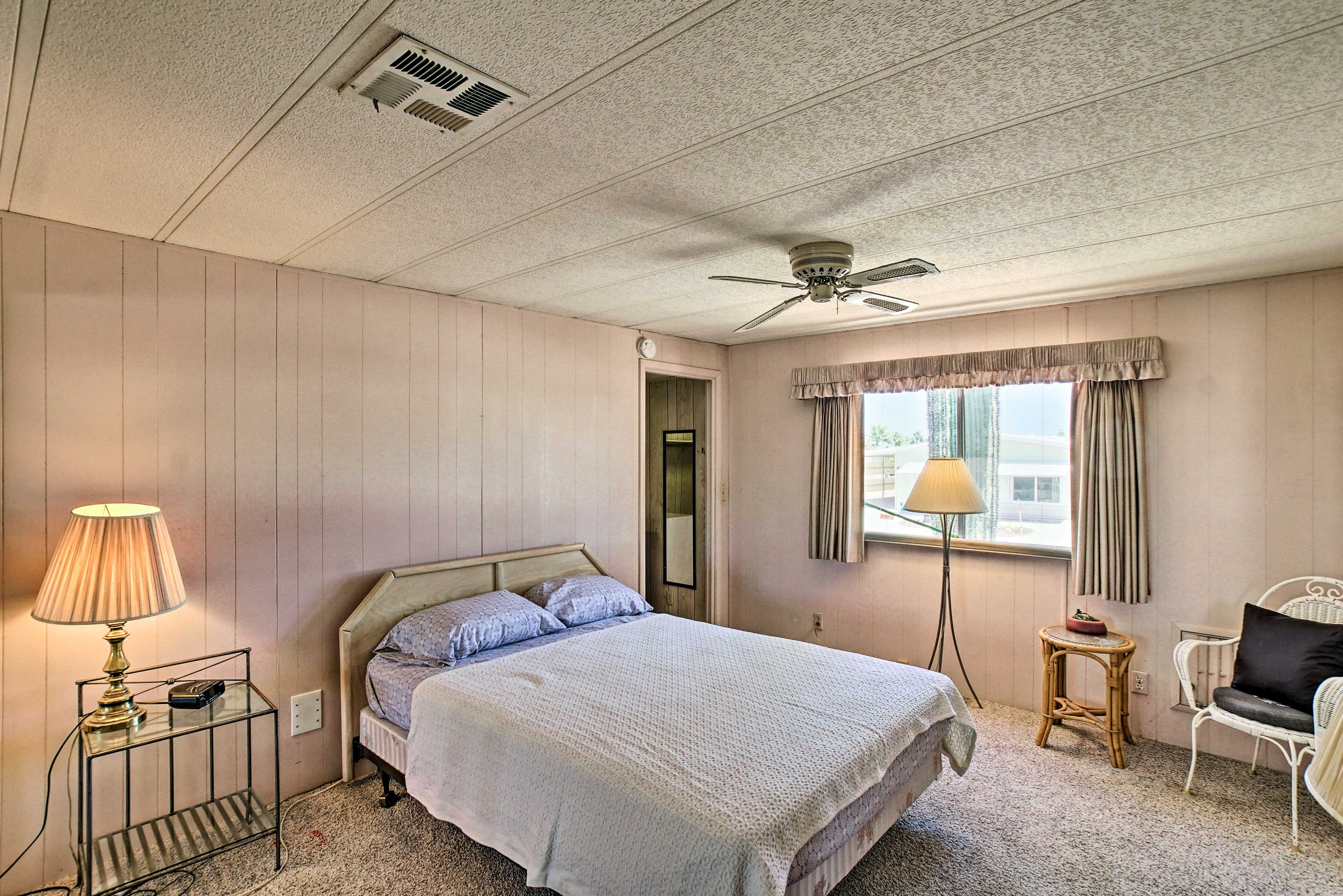 The first bedroom features a queen-sized bed.