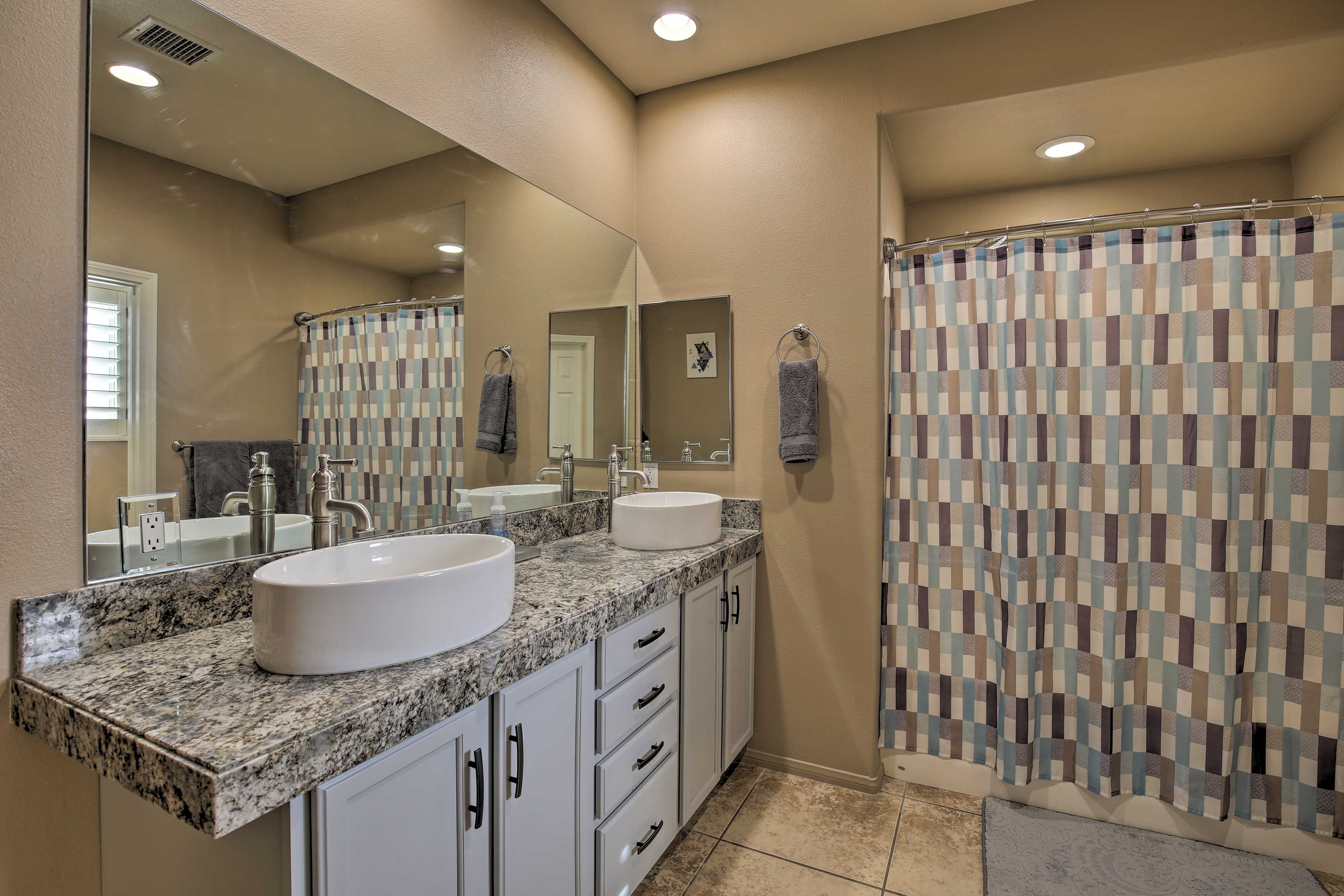 Wash up at the dual-sink vanity.