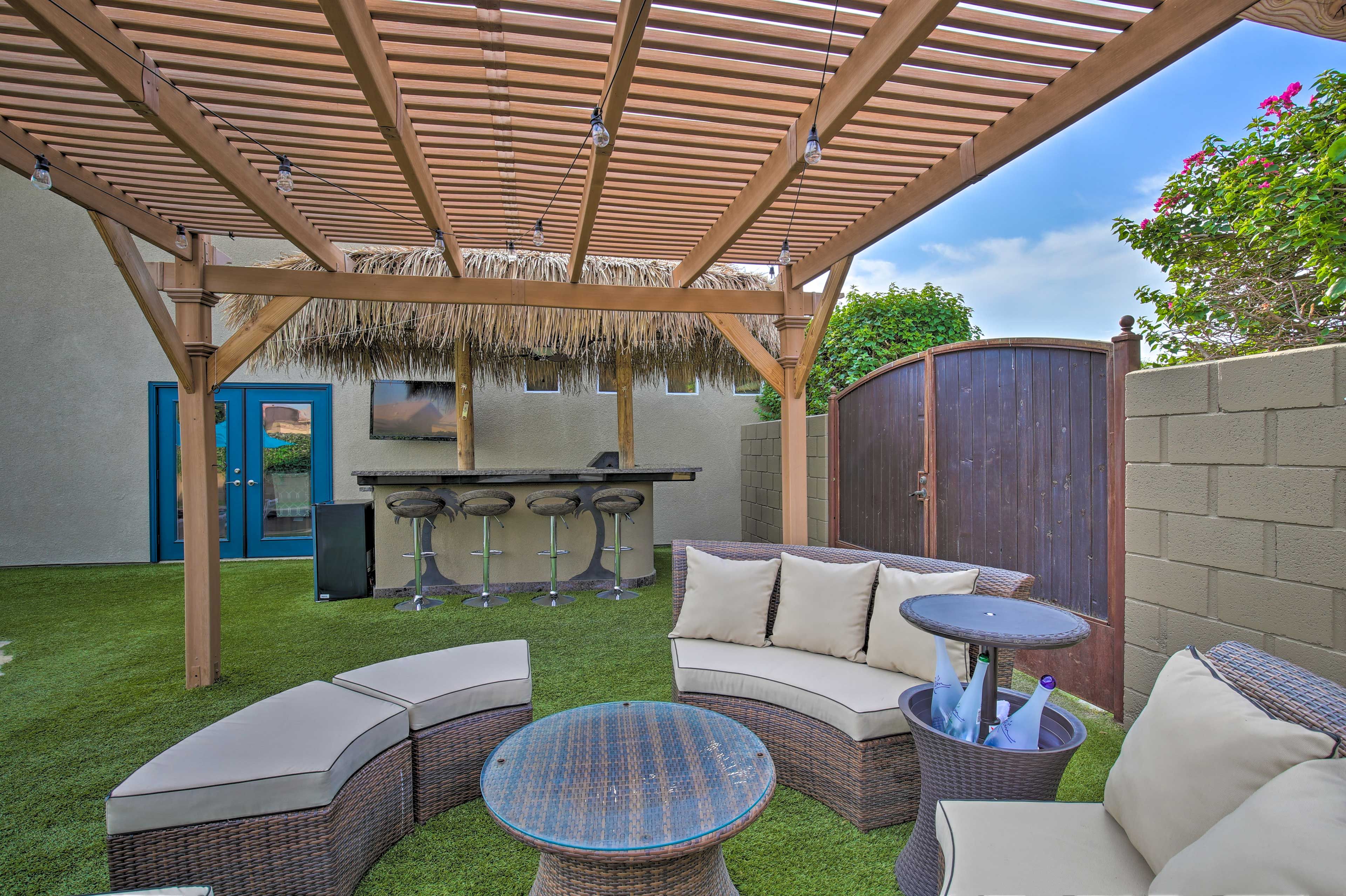 Keep your bottles cool while you unwind on the cushioned patio furniture.