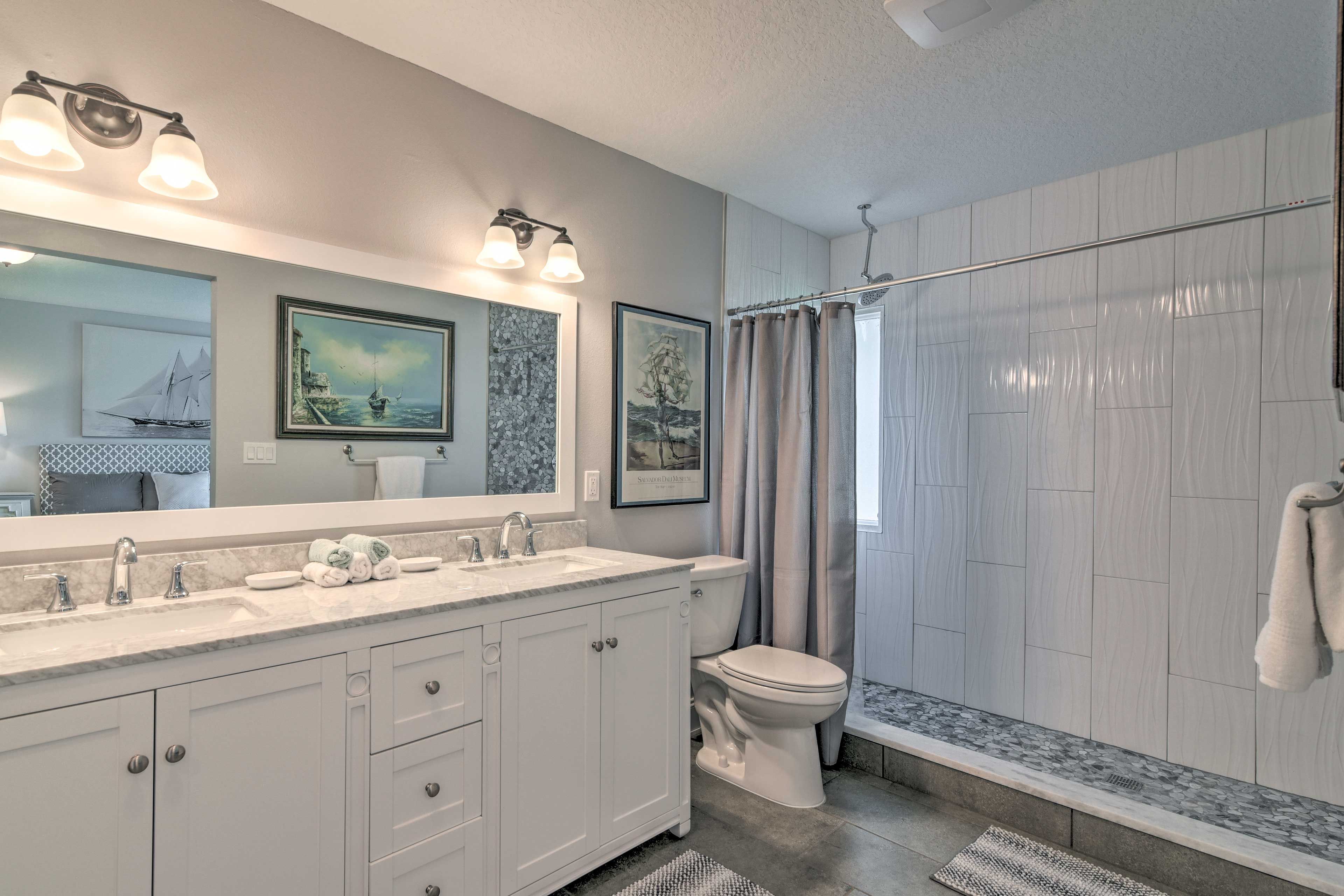 The en-suite bathroom features dual sinks and a walk-in shower!