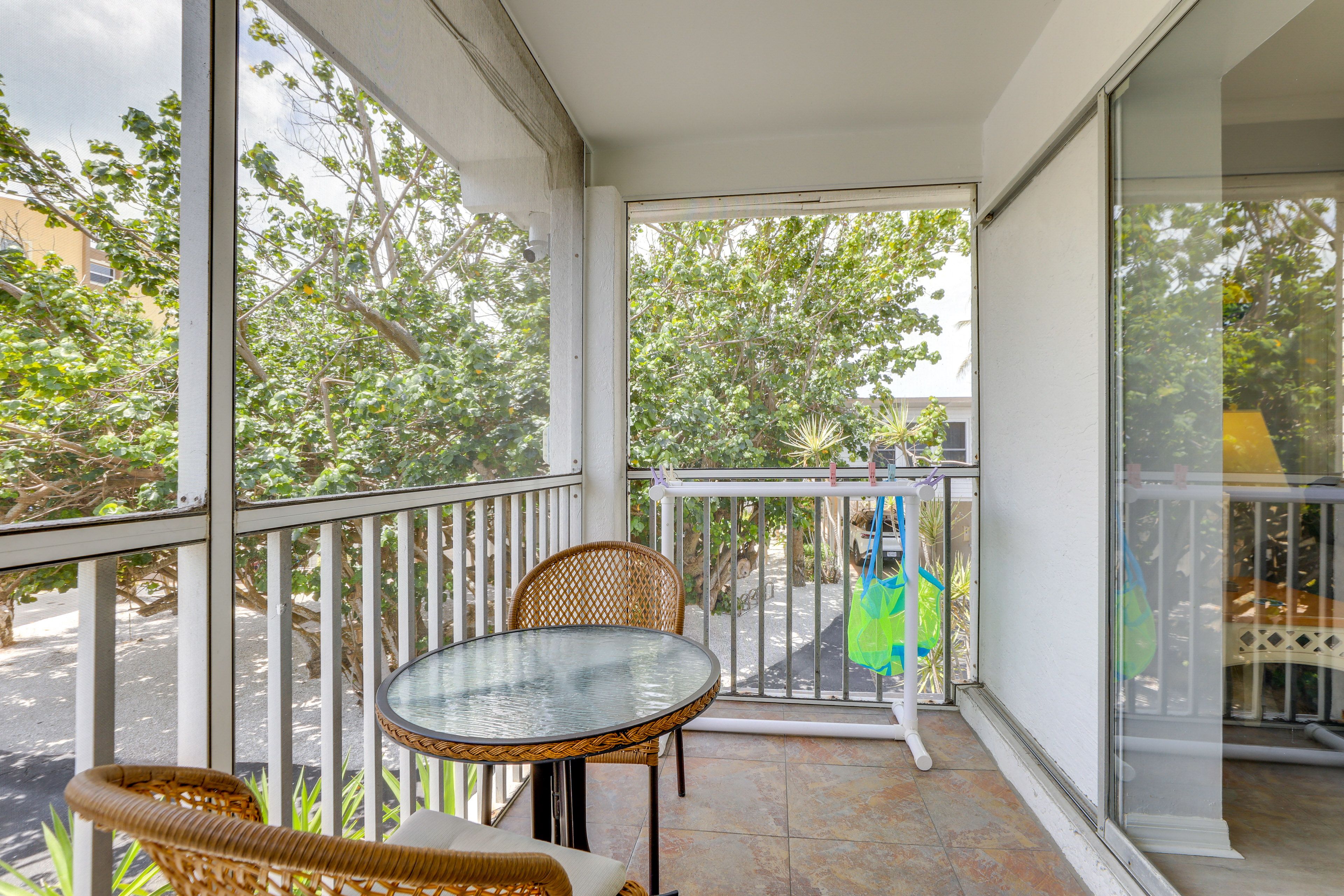 Screened-In Balcony | 2 Café Tables | Garden View