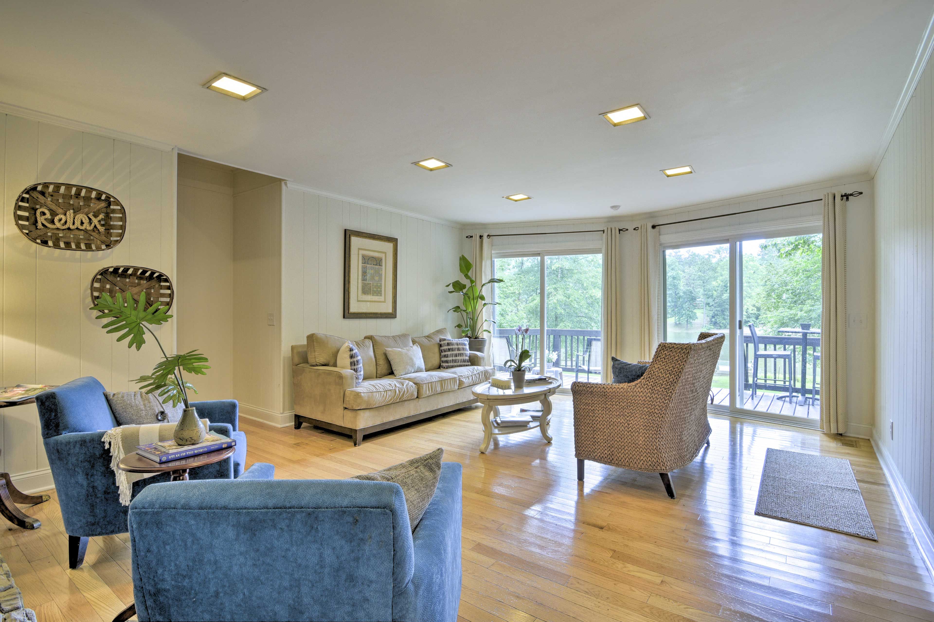 Hardwood floors reflect the sunlight streaming in.