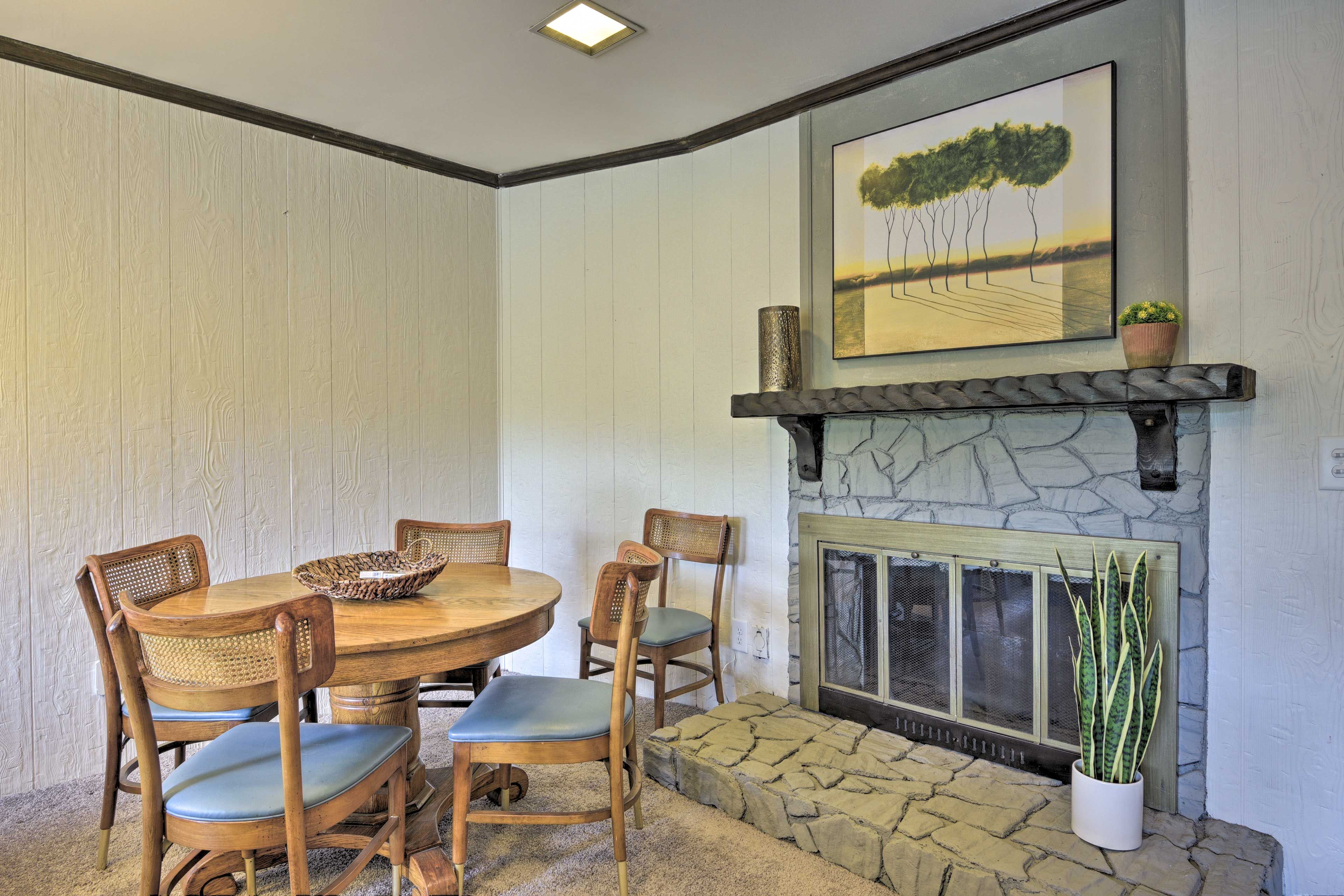 A dining table rests in the corner, perfect for board games!