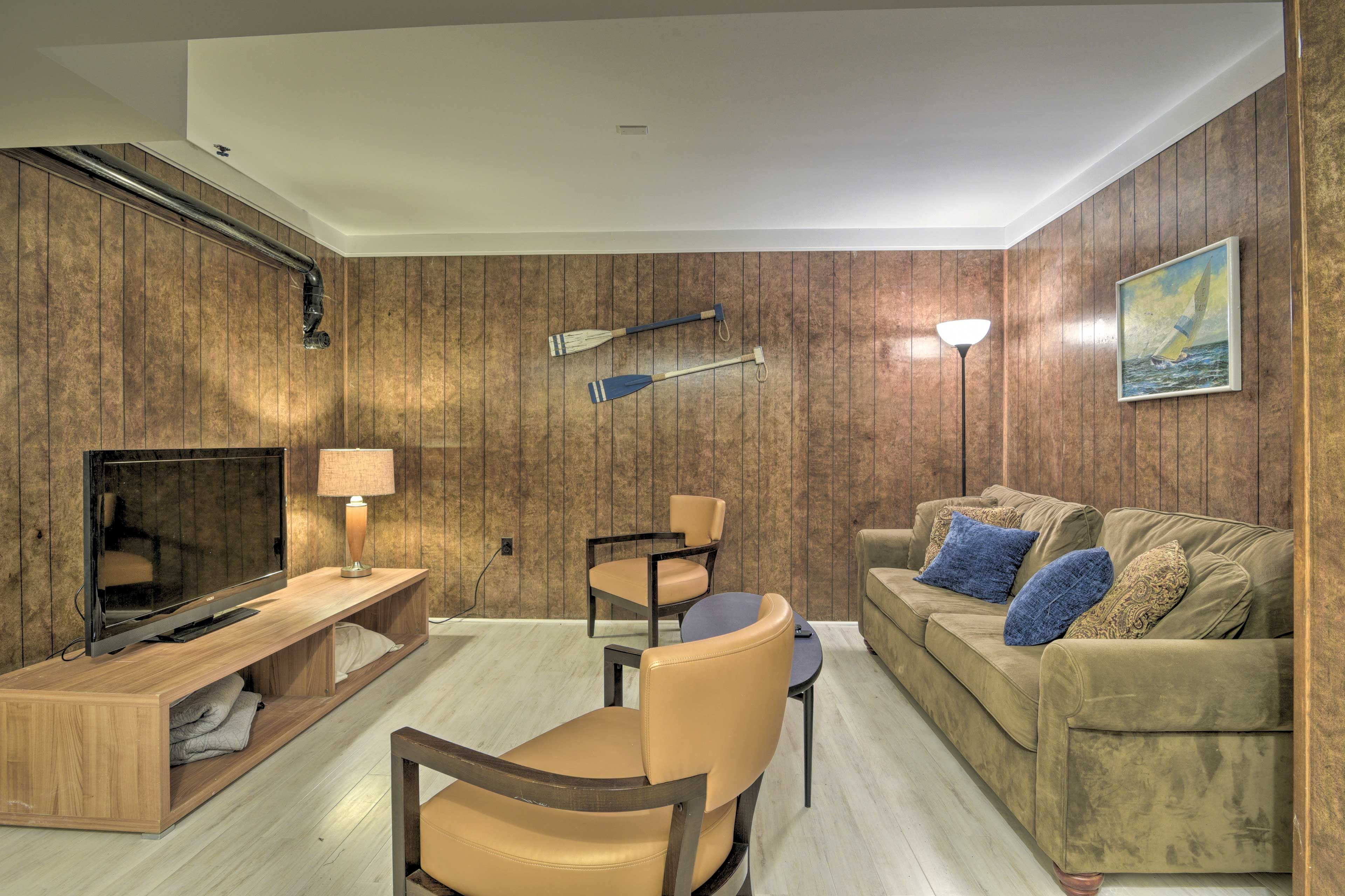 Downstairs, this living area features a cable TV and a sleeper sofa.