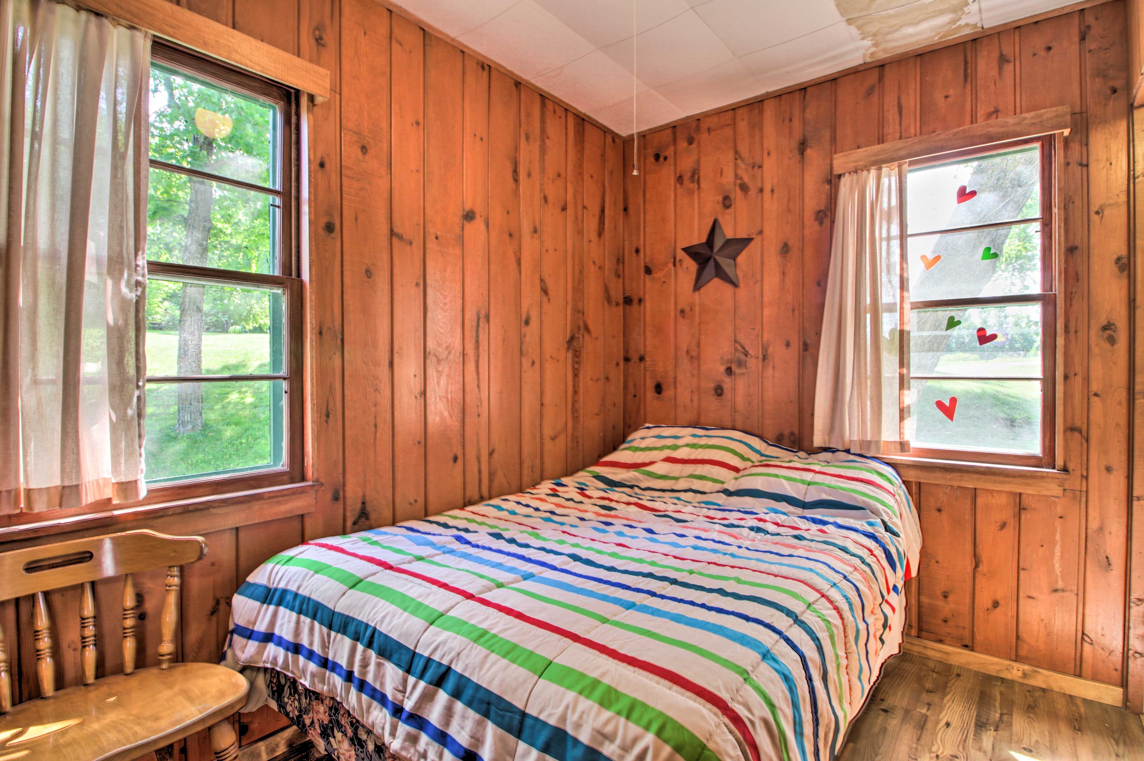 Another full bed highlights the second bedroom.
