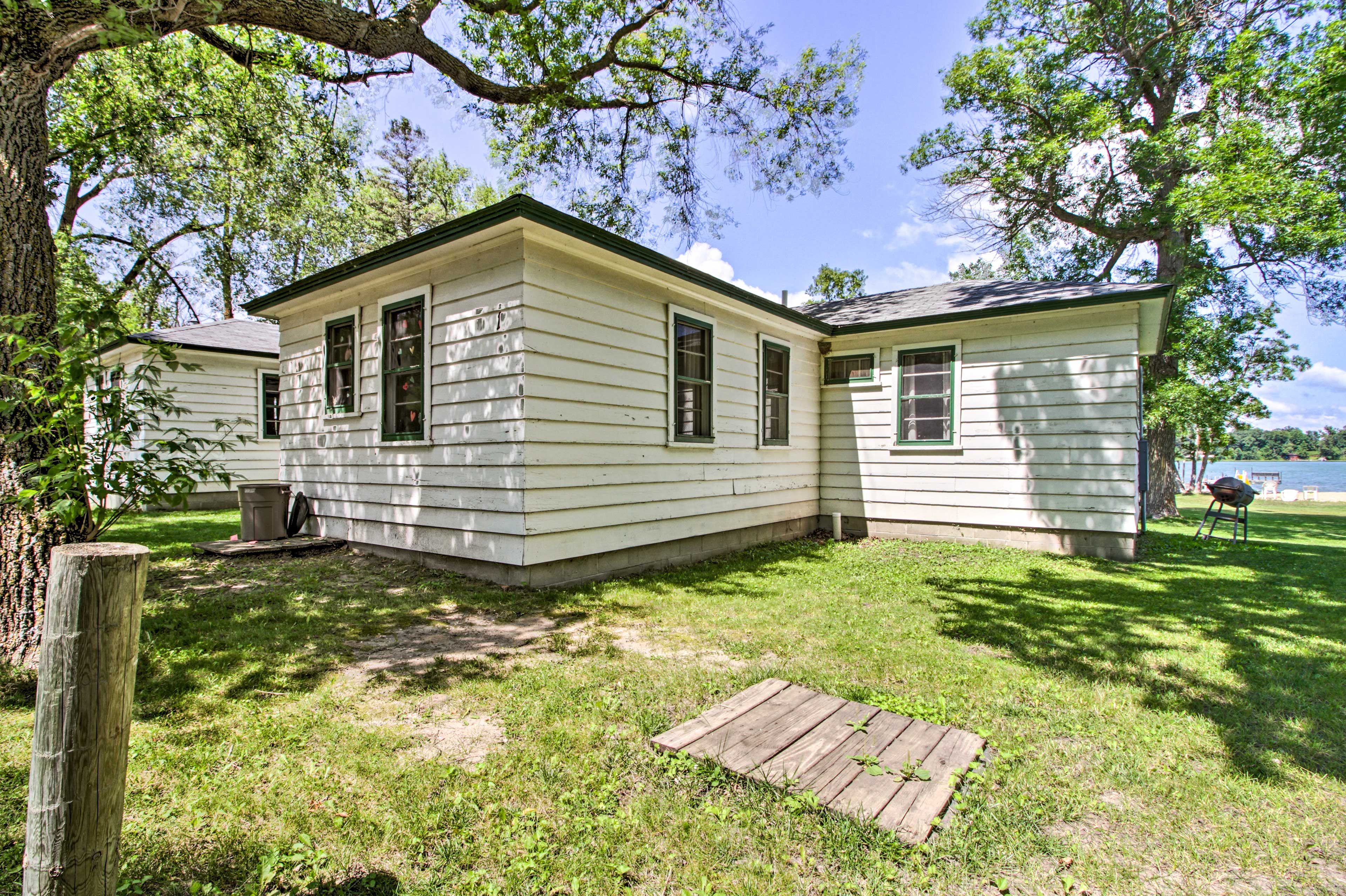 This home has plenty of yard space and a charcoal grill.