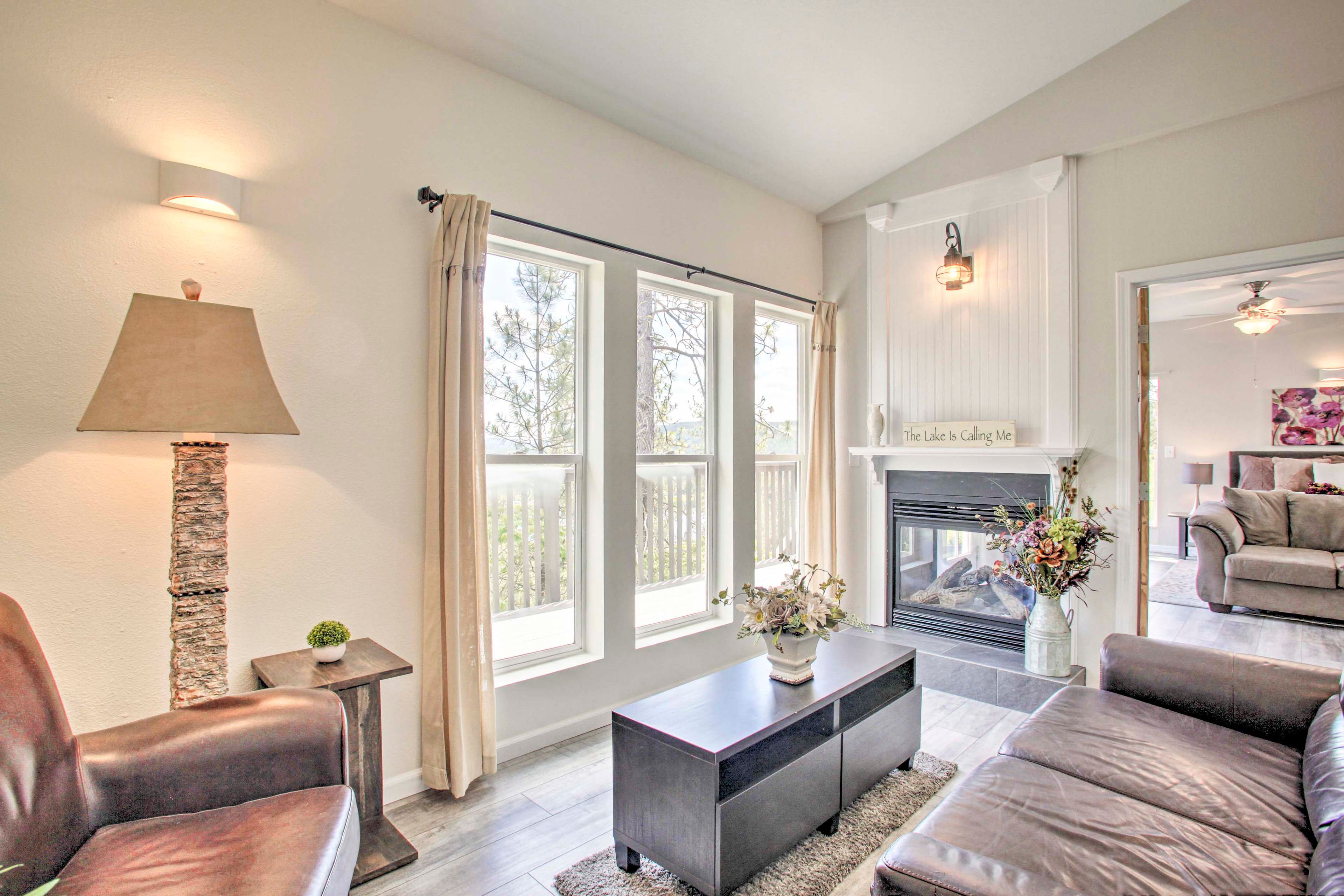 Living Room | 2-Sided Stone Gas Fireplace | Free WiFi | Laminate Floors