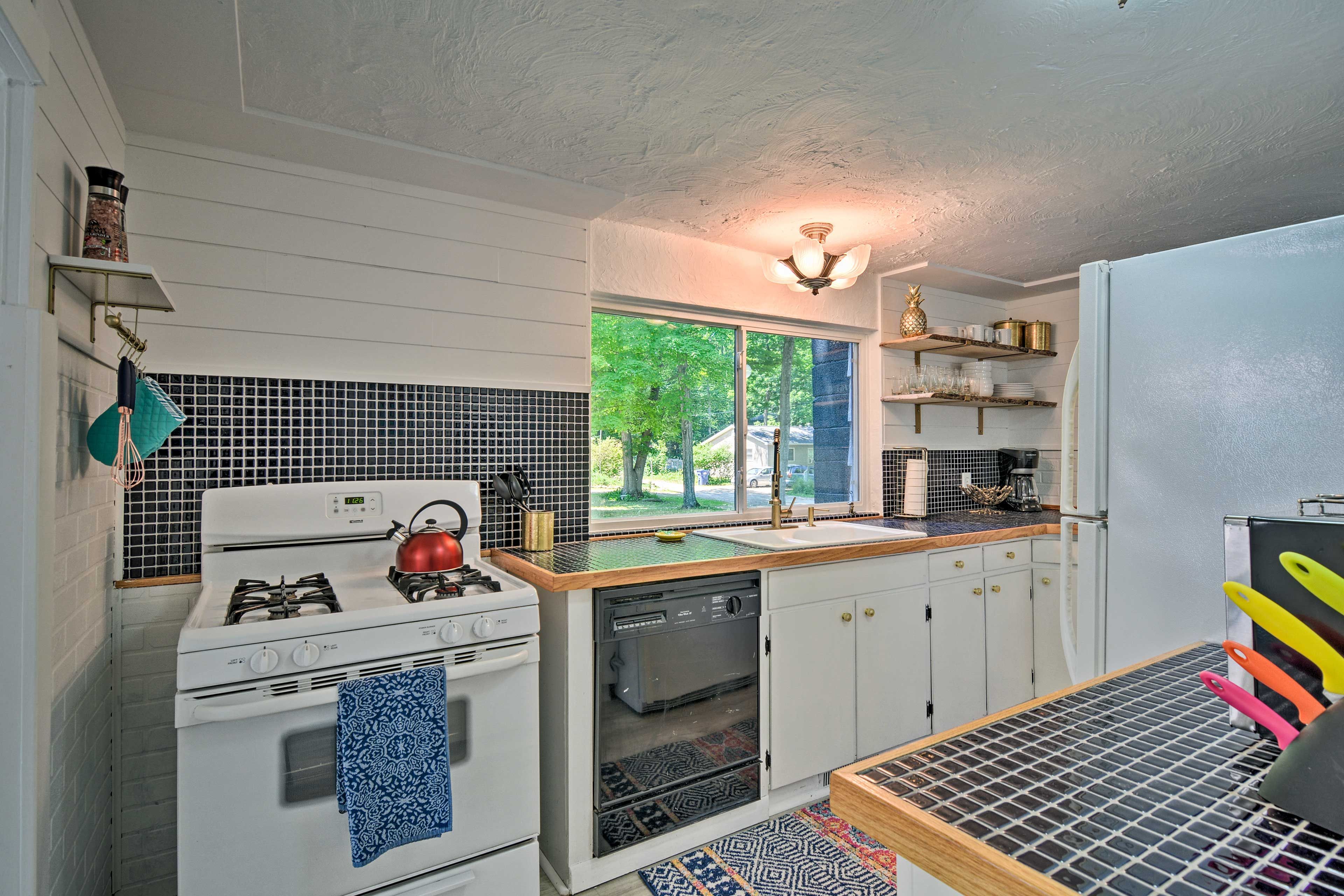 The kitchen is fully equipped with all the essential appliances.