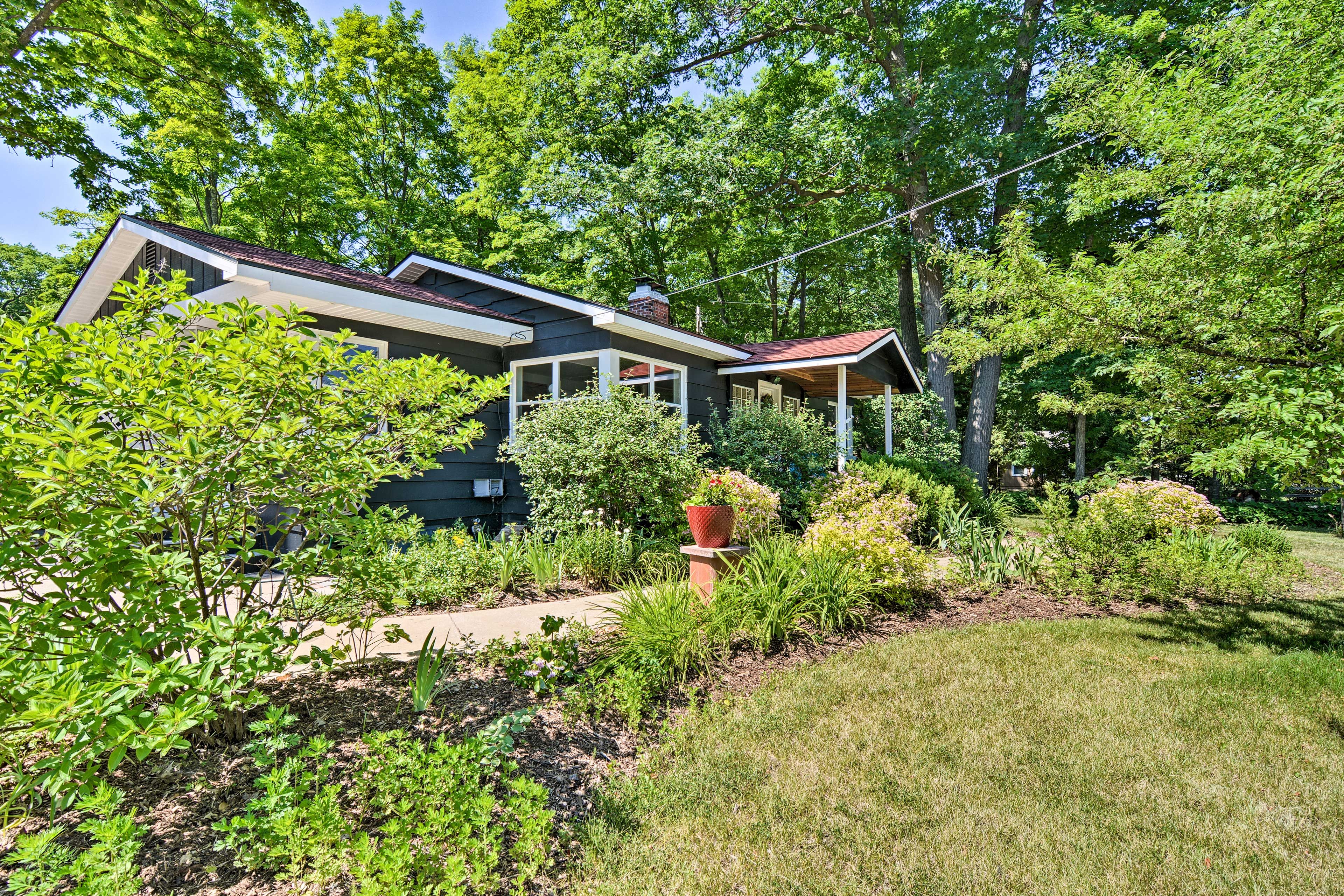 Greenery surrounds this lovely lakeside home.