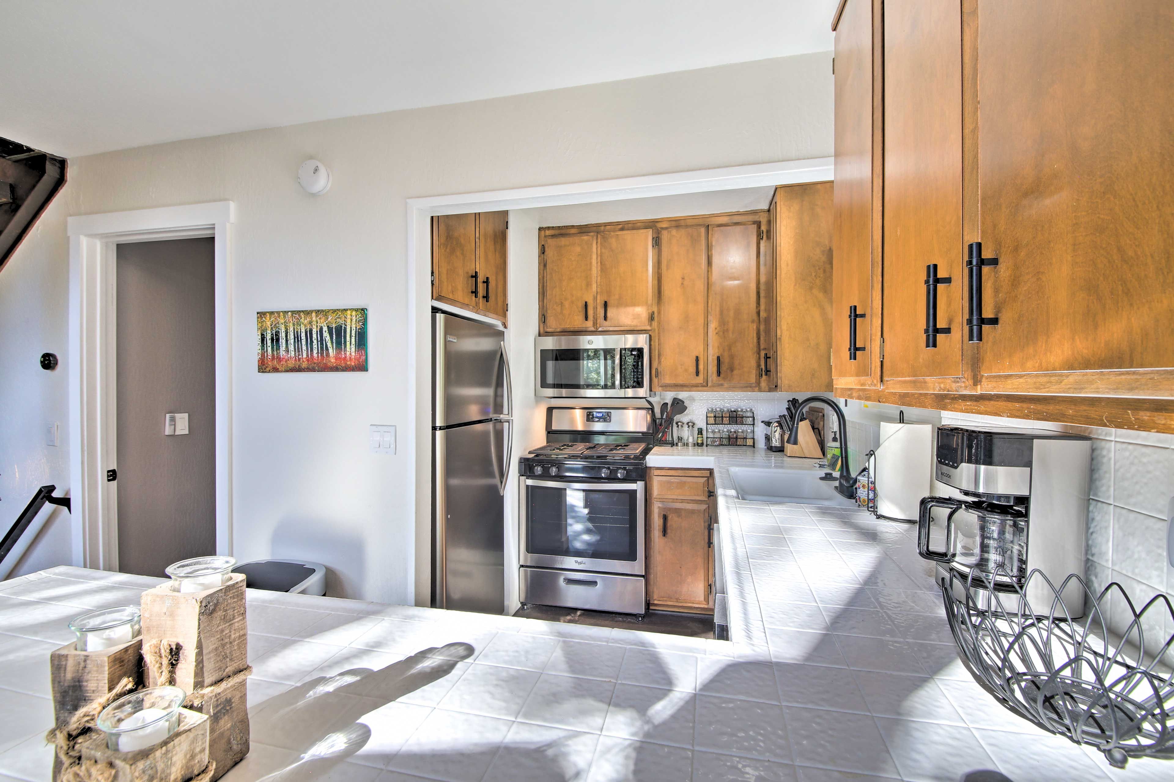 The kitchen comes fully equipped with all your culinary essentials.