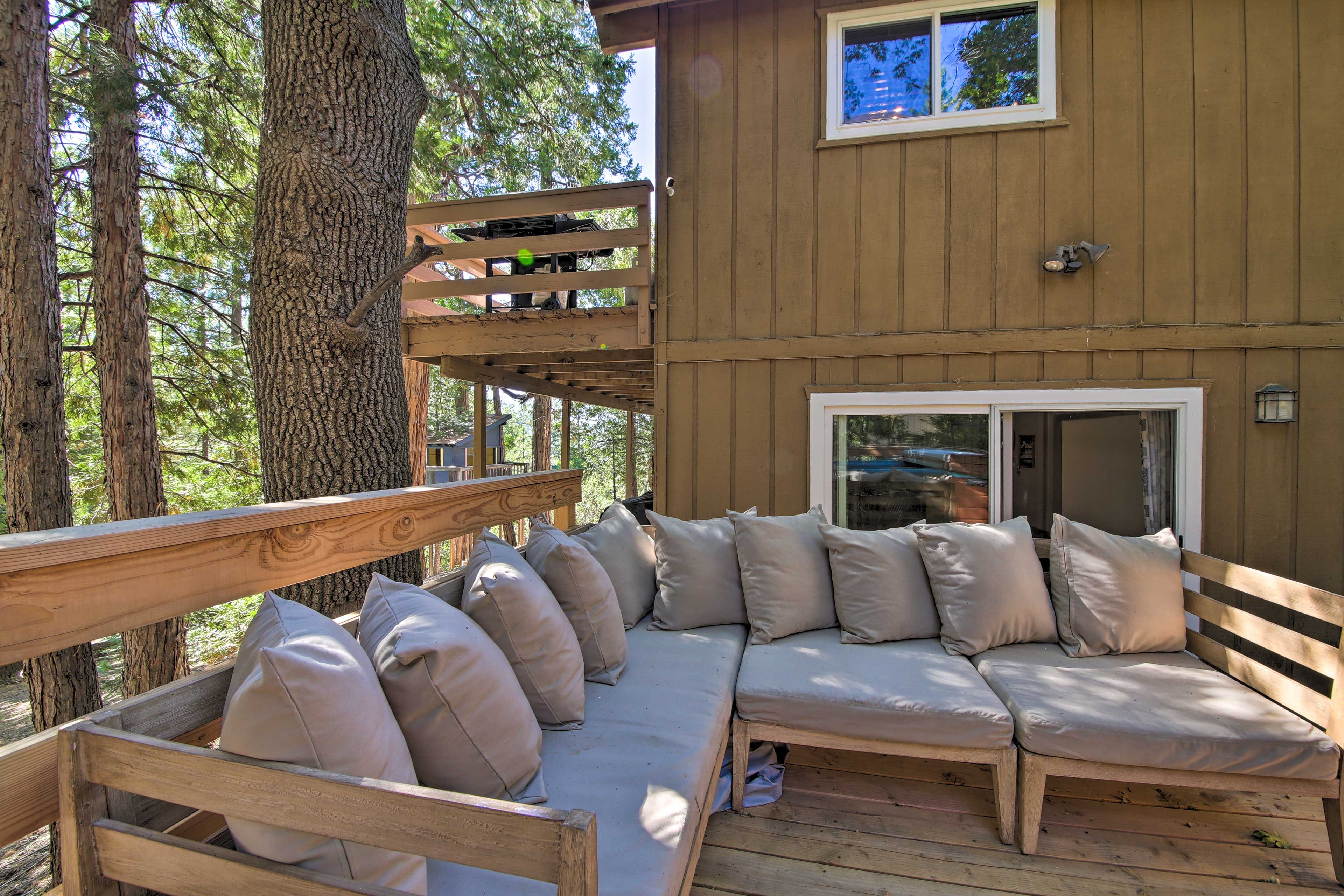 Recount the day's outdoor adventures around the outdoor sofa.