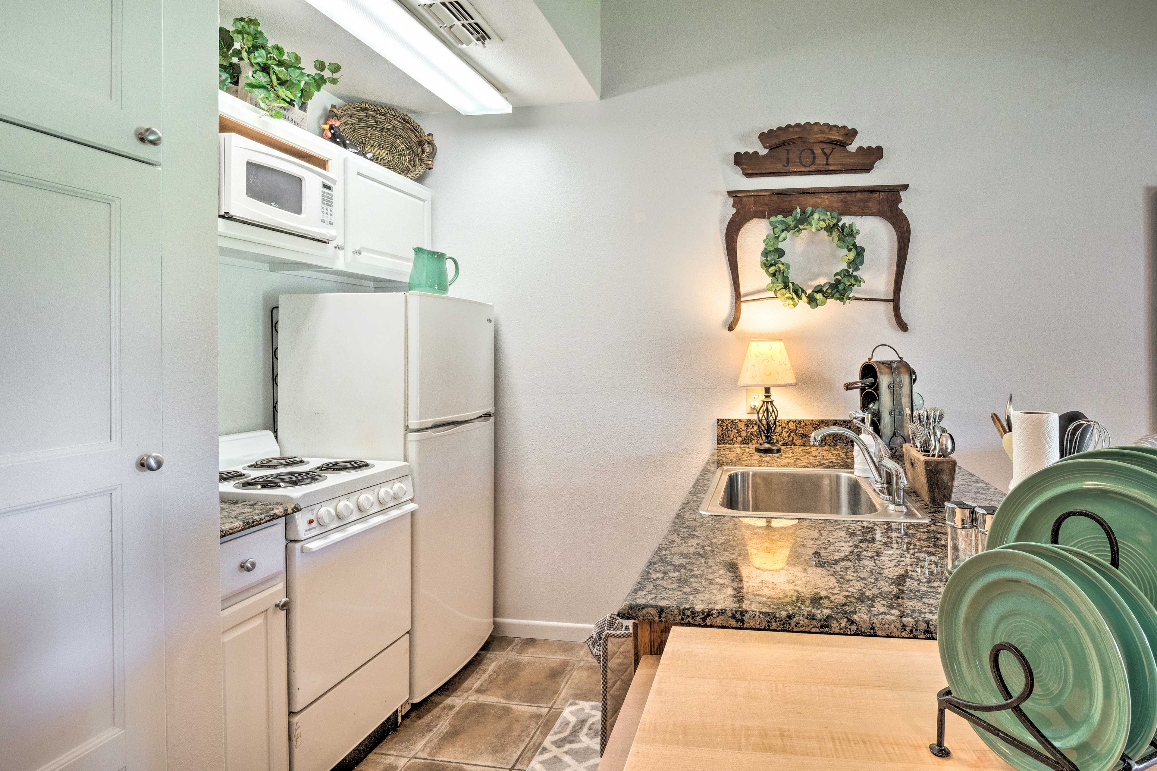 With an oven, microwave, and fridge, the kitchen comes well equipped.