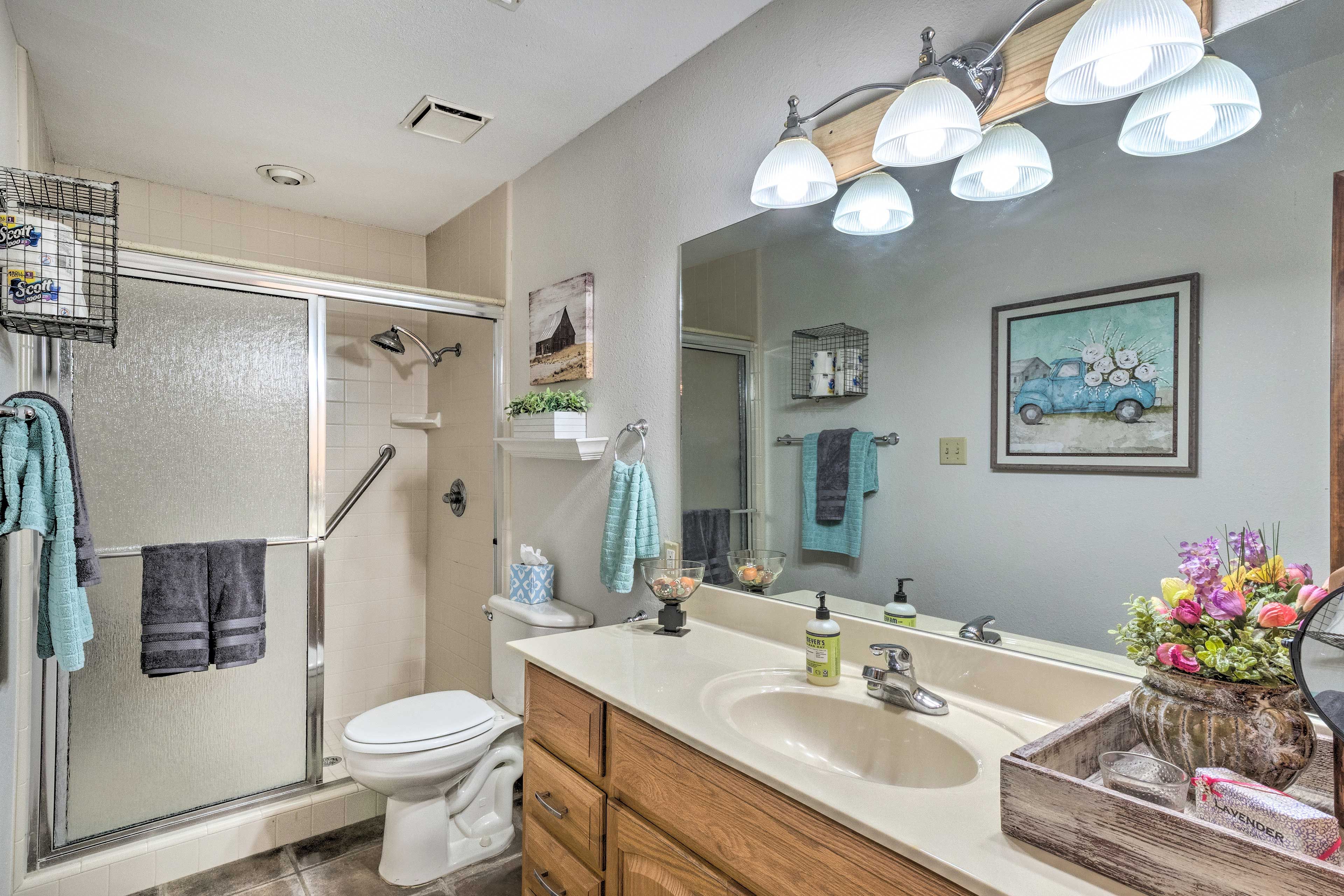 The bathroom is both spacious and elegant.