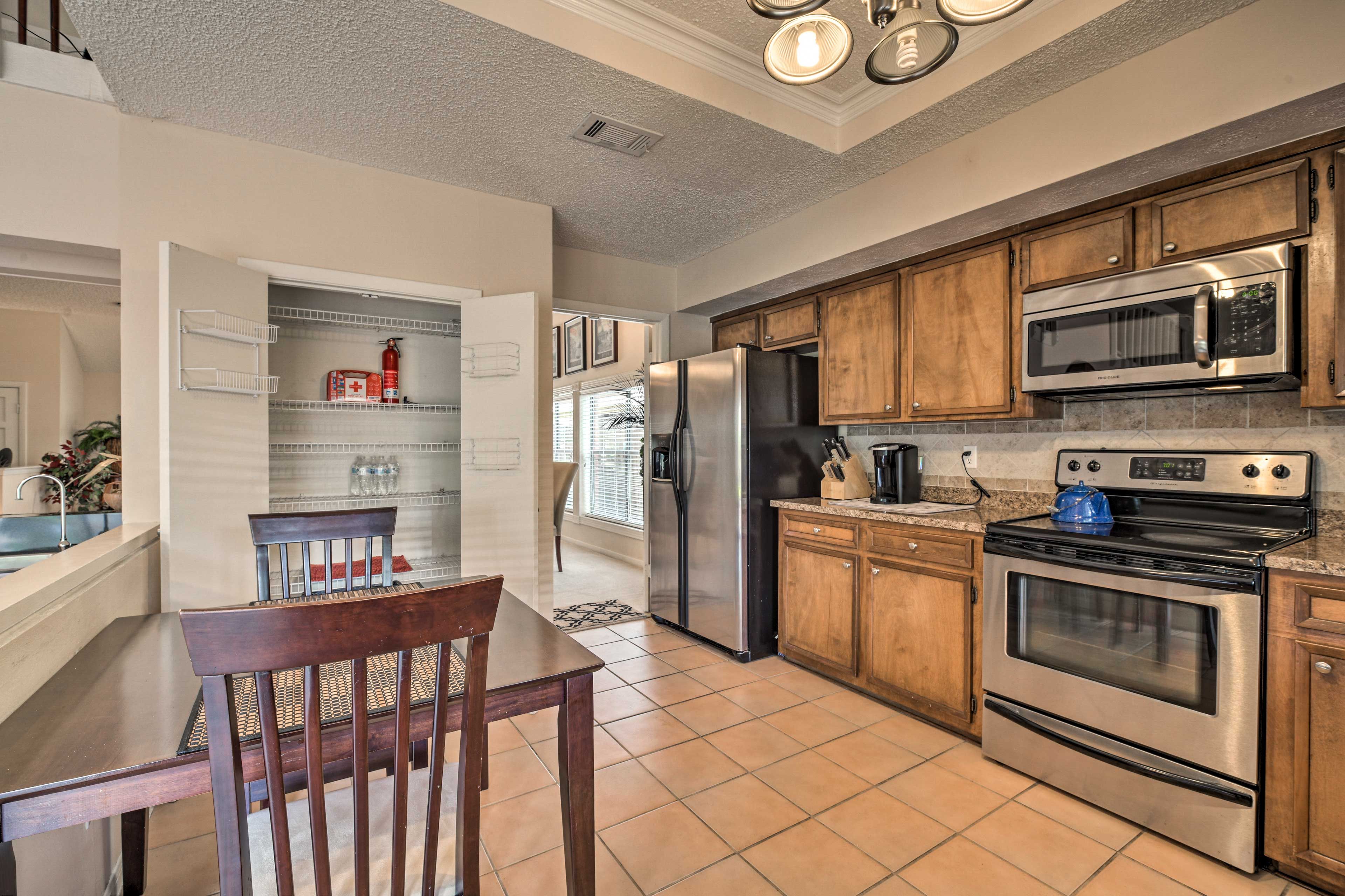The space comes fully equipped with stainless steel appliances.