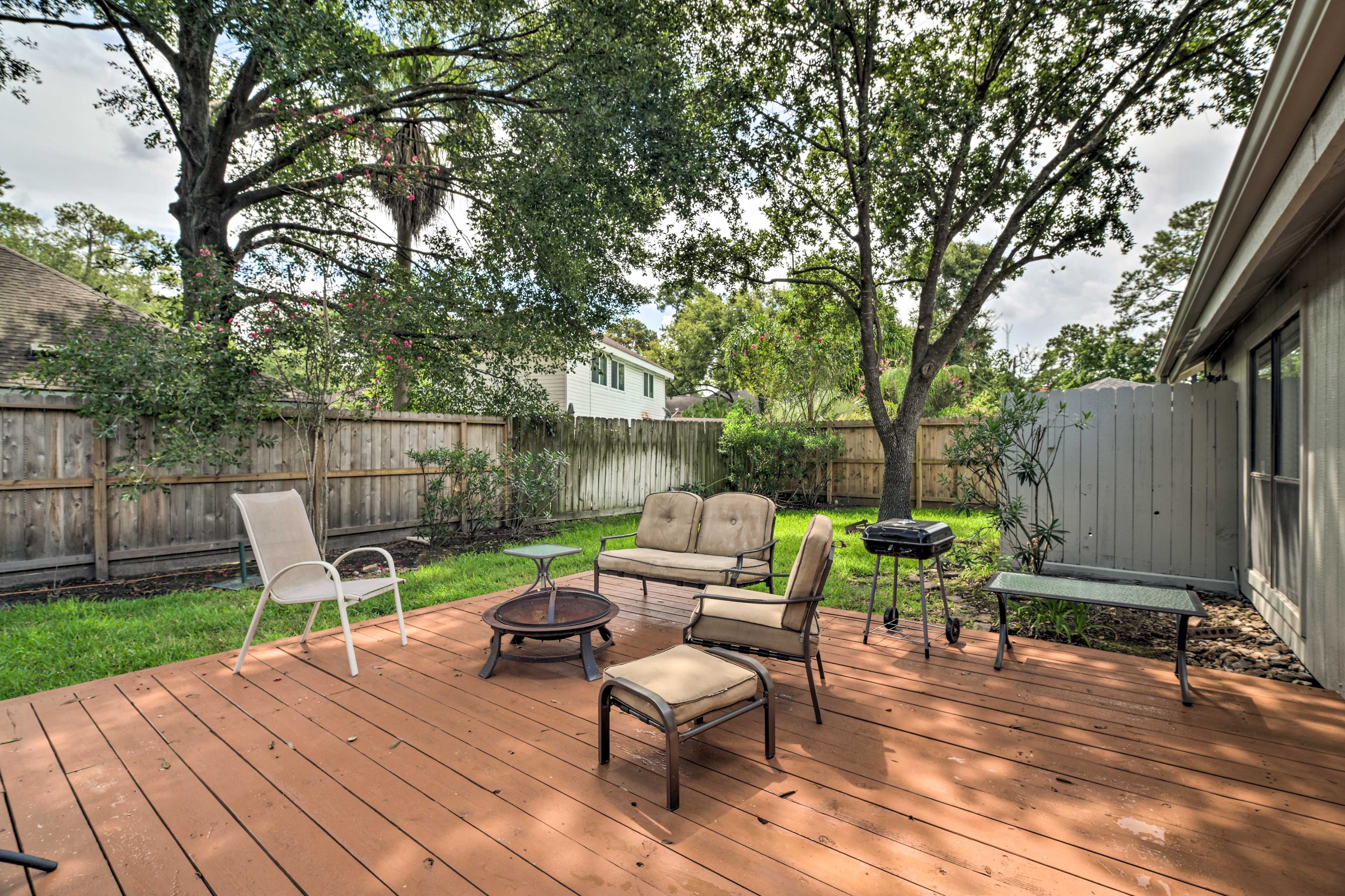 Sit out on the deck in the private yard and fire up the charcoal grill.