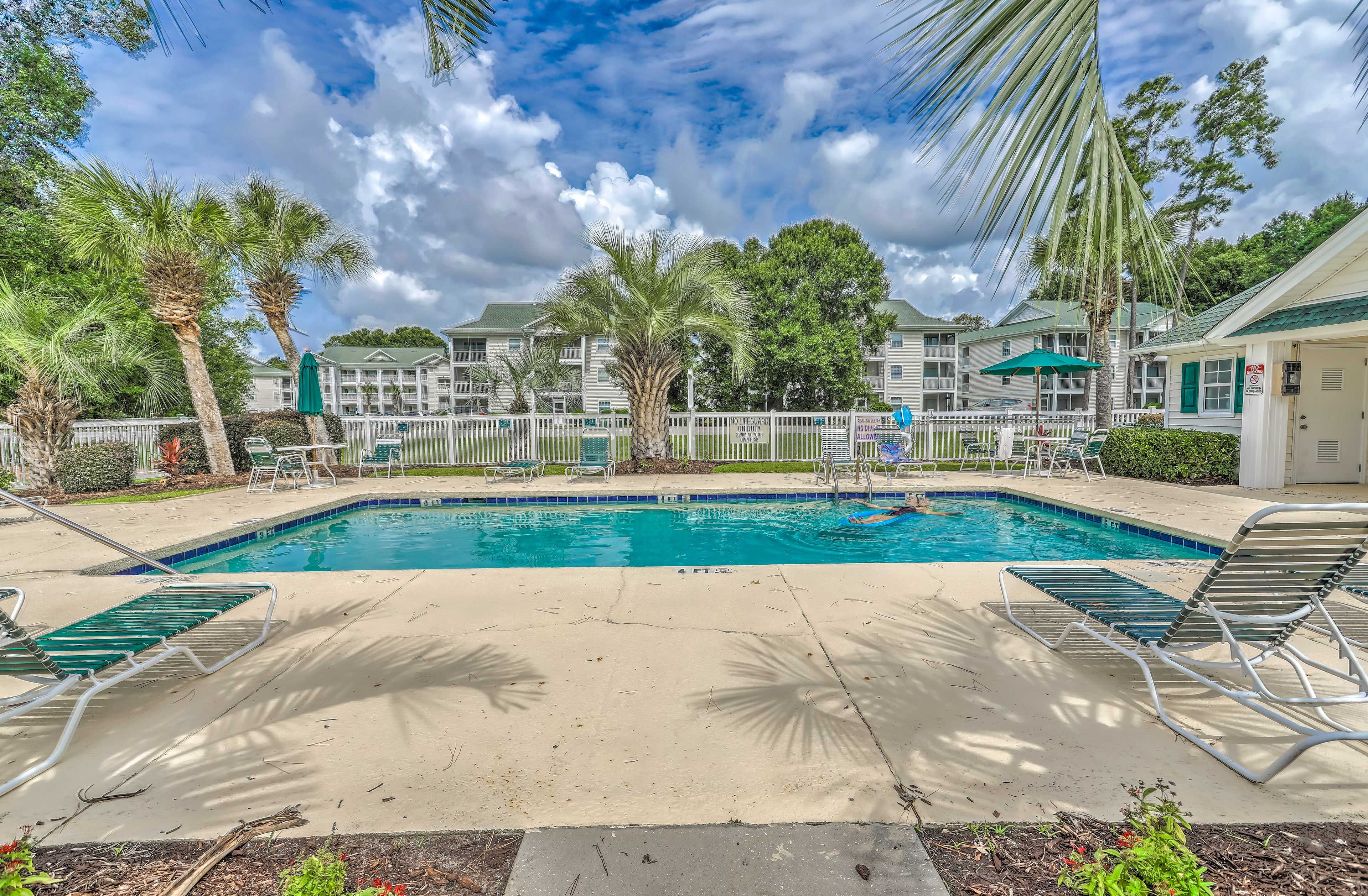 Chill poolside at this vacation rental.