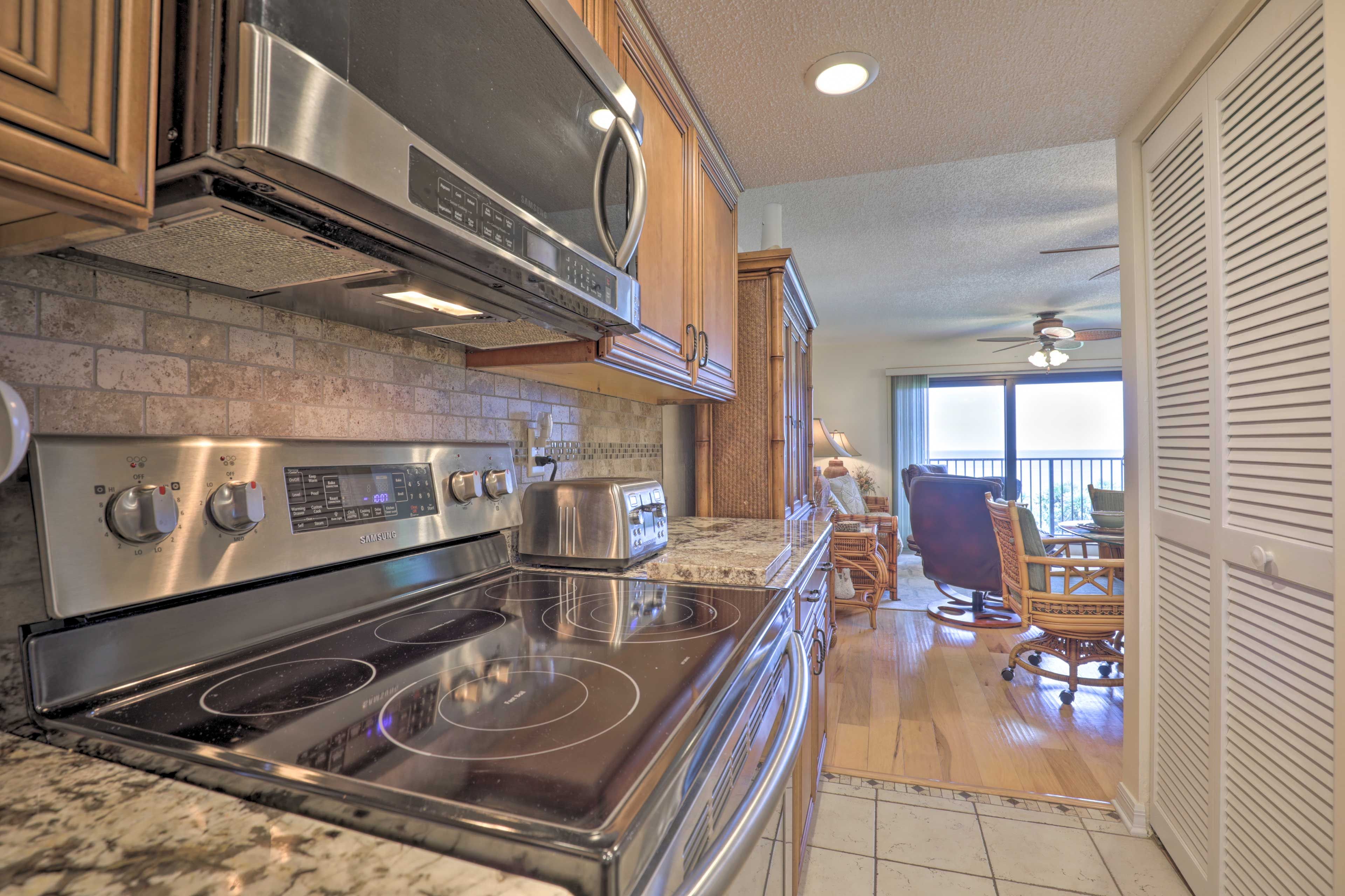 Stainless steel appliances complete this modern kitchen.