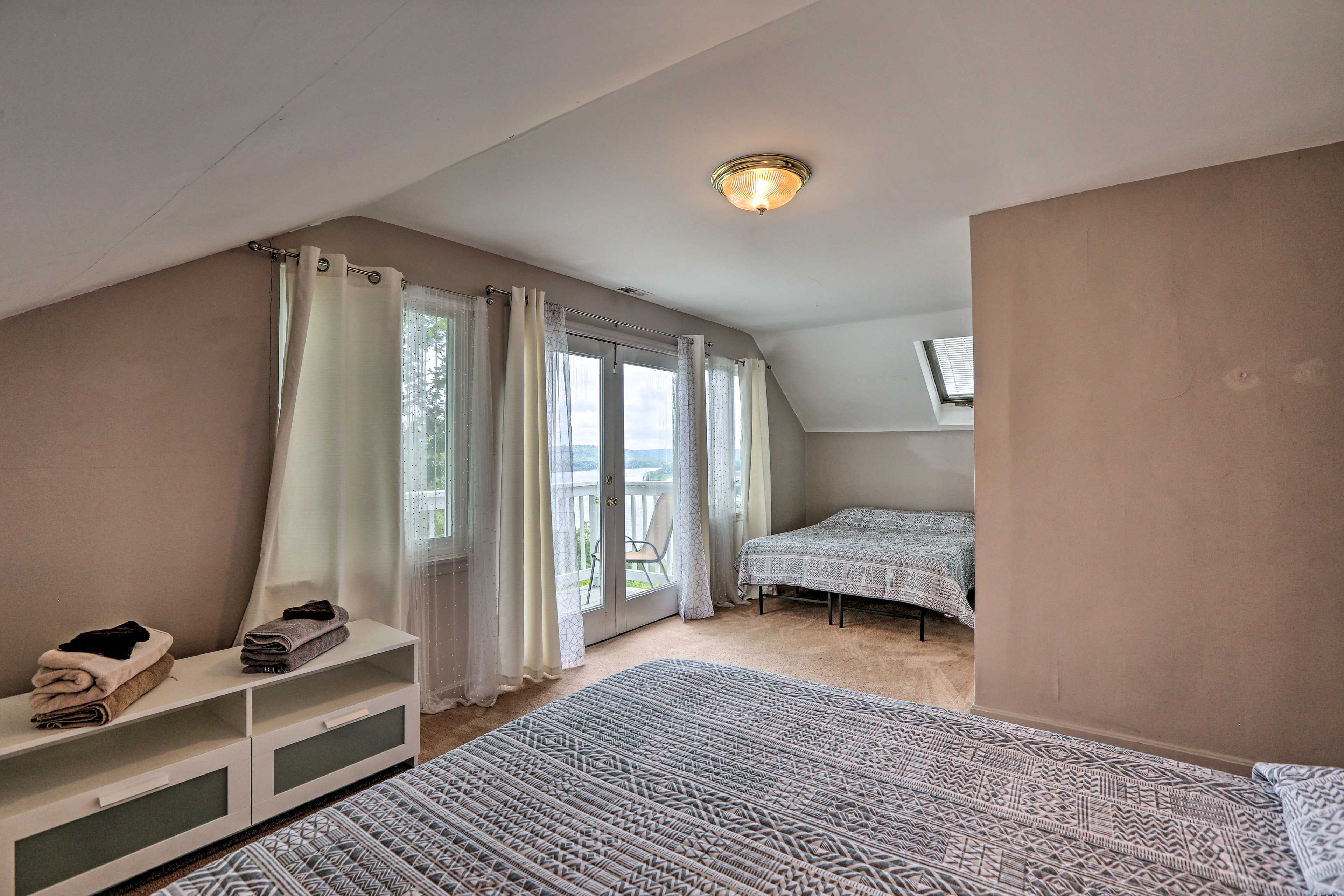Master Bedroom | 2 Queen Beds | Balcony Access