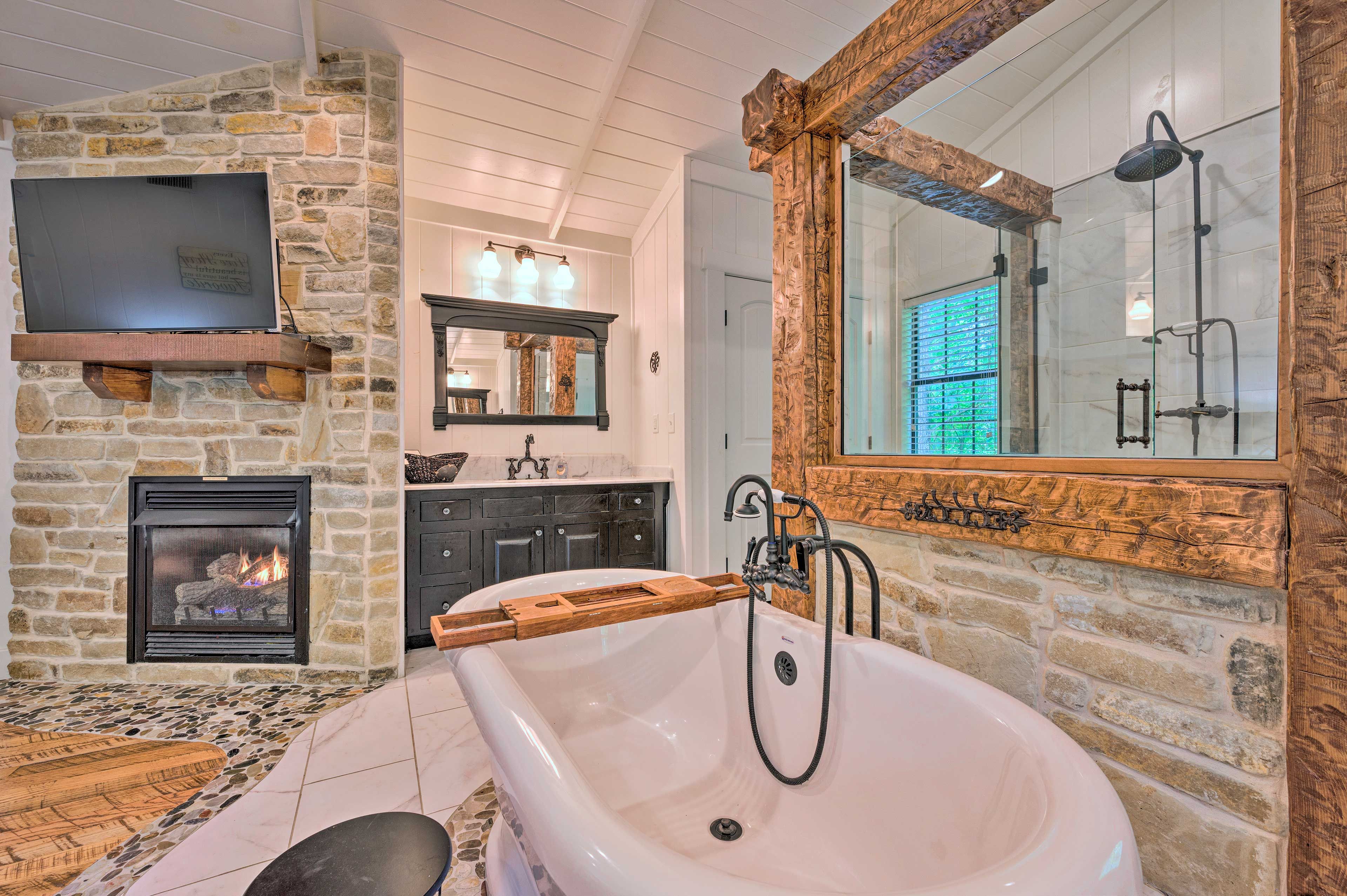 The en-suite bathroom features a tub and glass-frame shower.