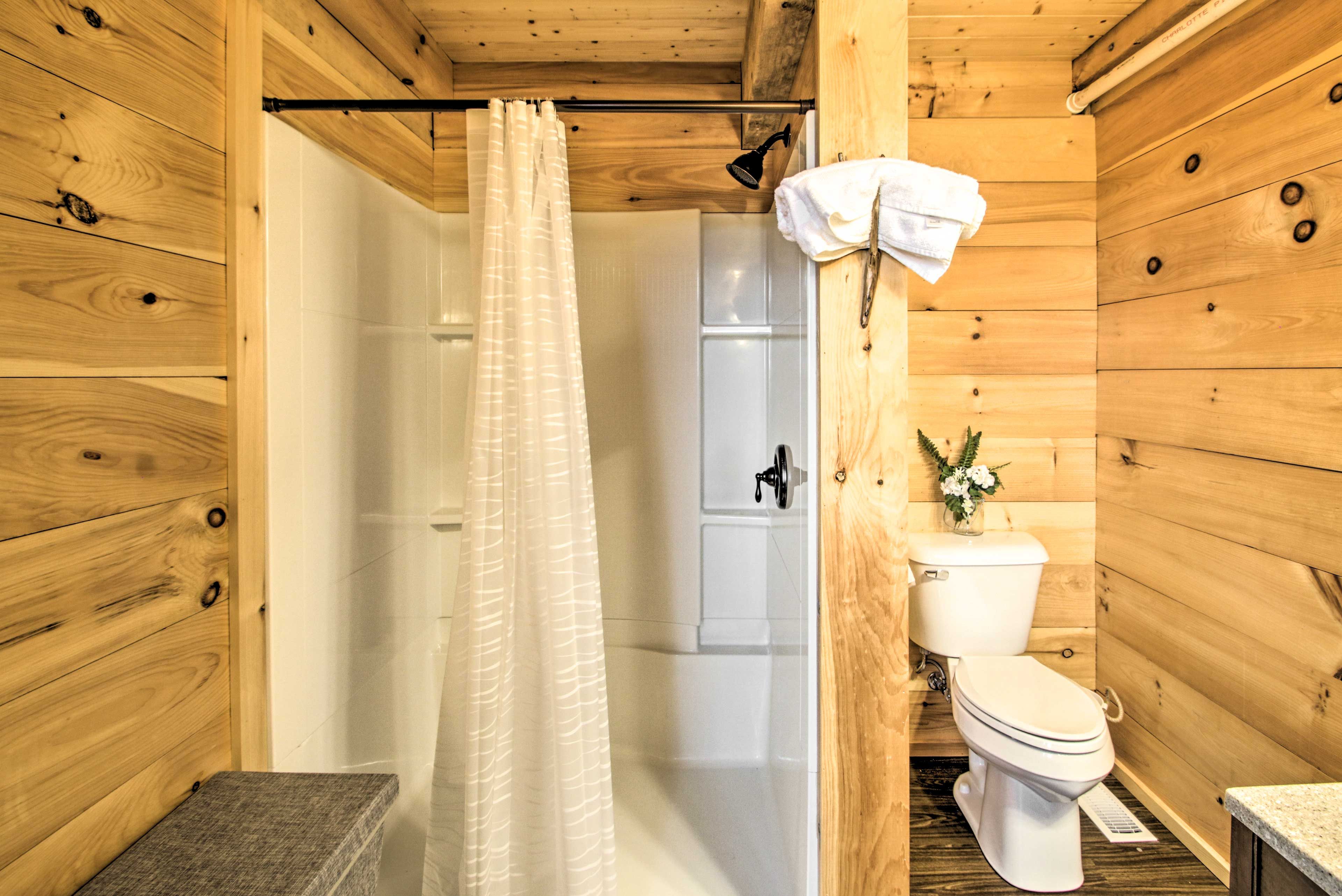 Freshen up with a hot shower in the bathroom.