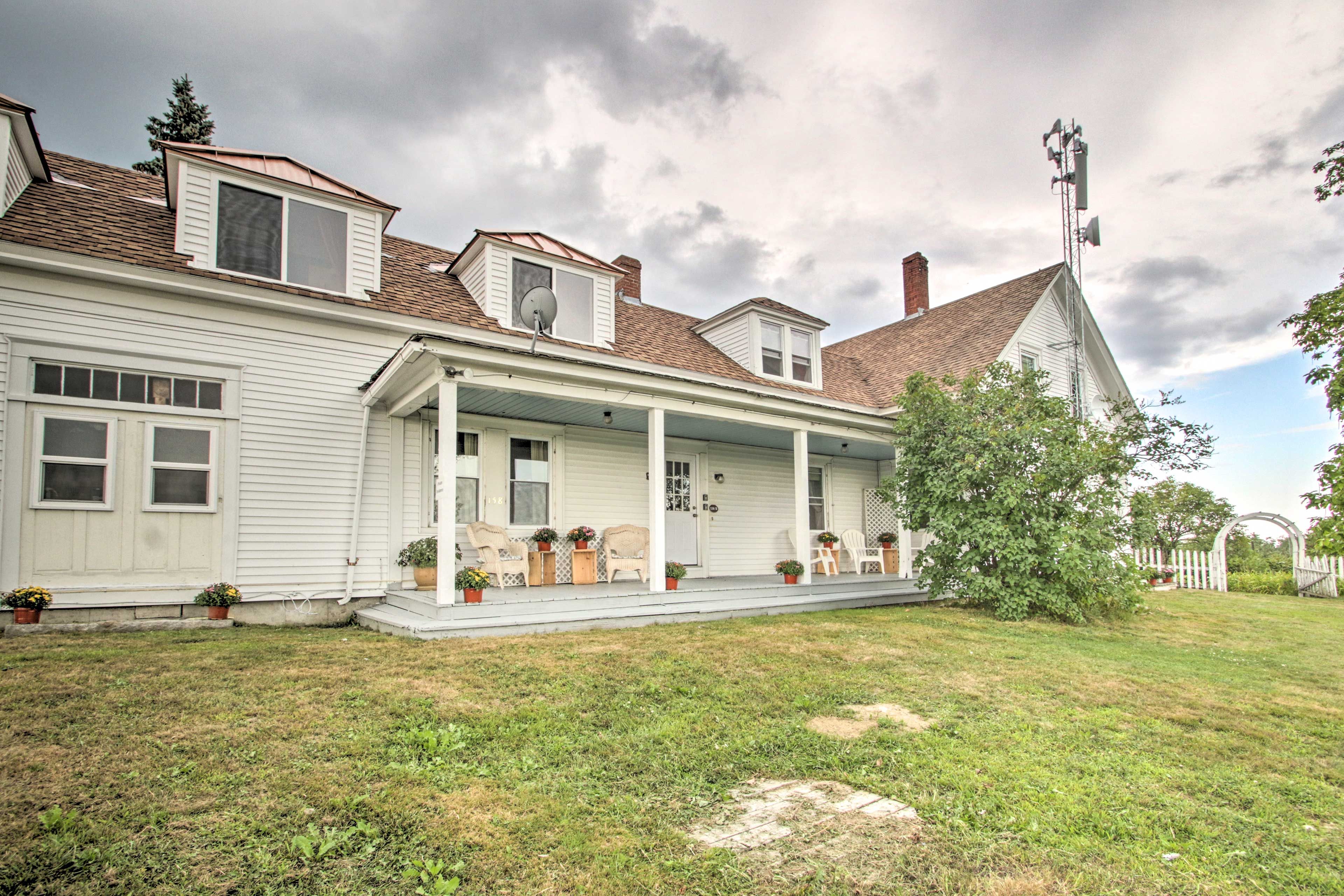 Admire the architecture of this classic cape-style house.