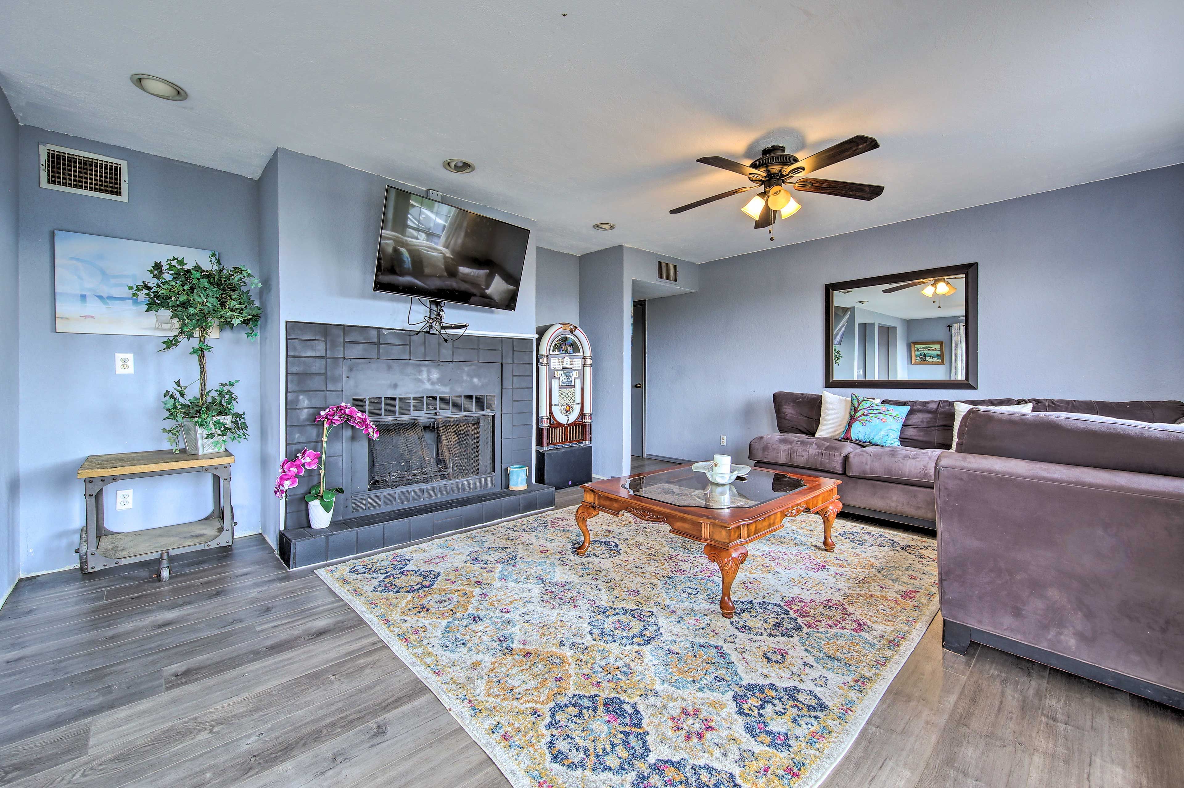 Unwind with a show on the Smart TV while the fireplace crackles.