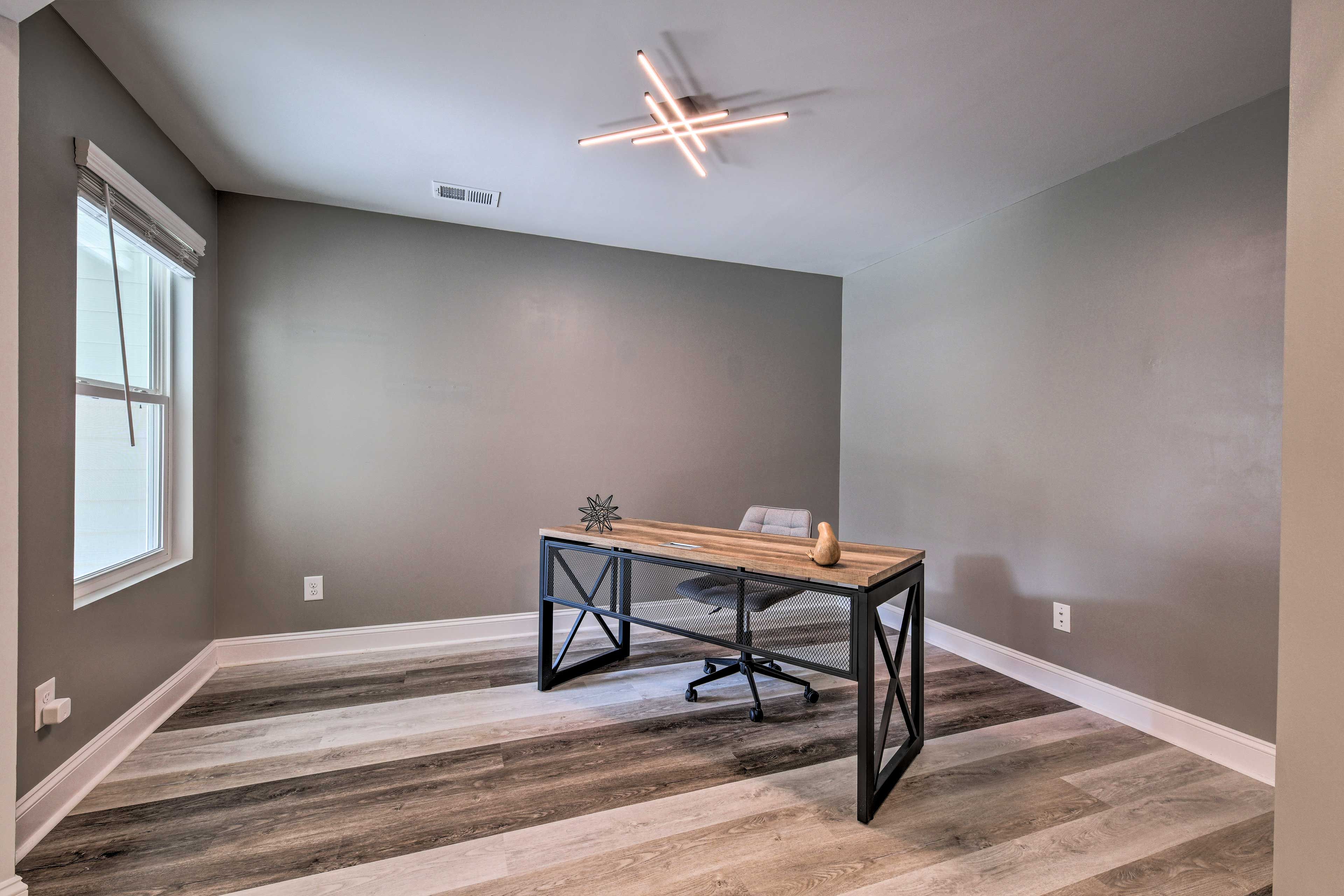 Check on out-of-office emails at the private desk.