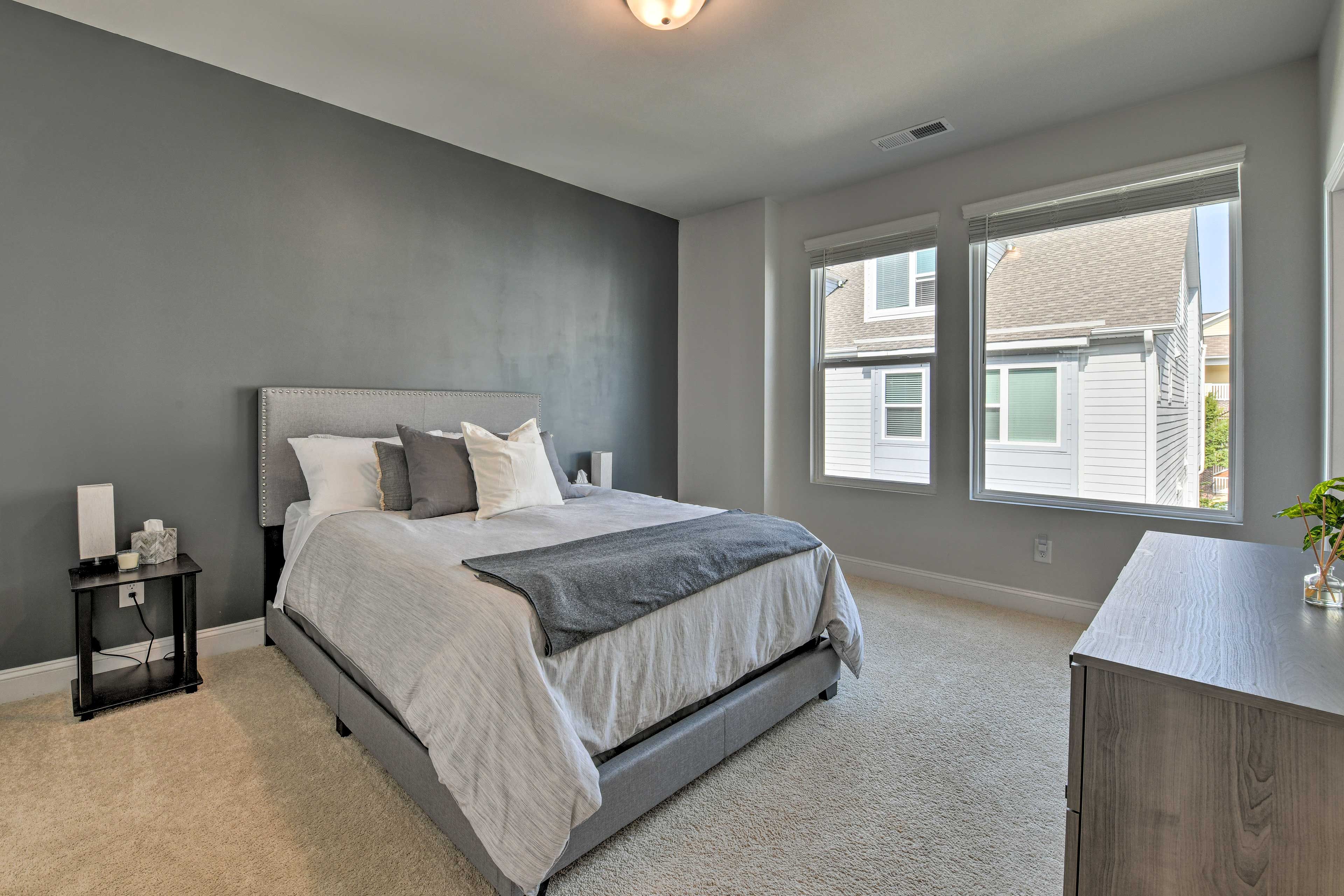 The master bedroom is equipped with a queen bed.