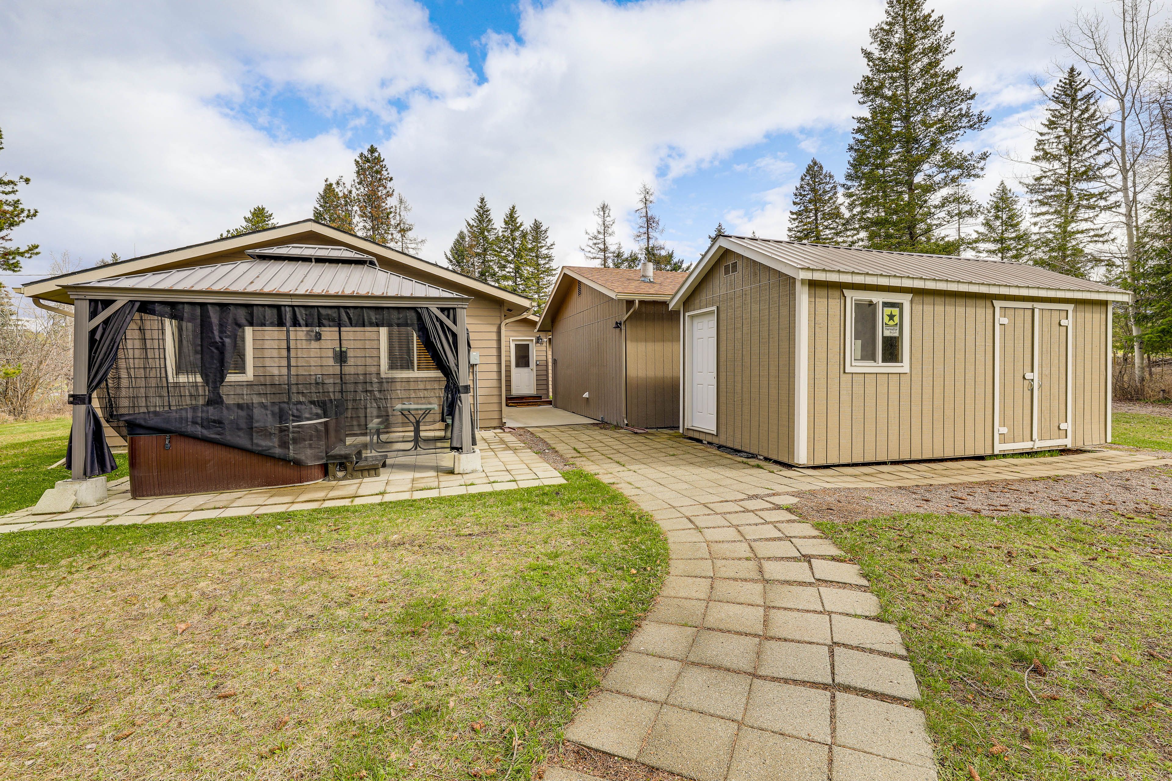 Exterior | Covered Hot Tub | Outdoor Dining | Gazebo | Fire Pit