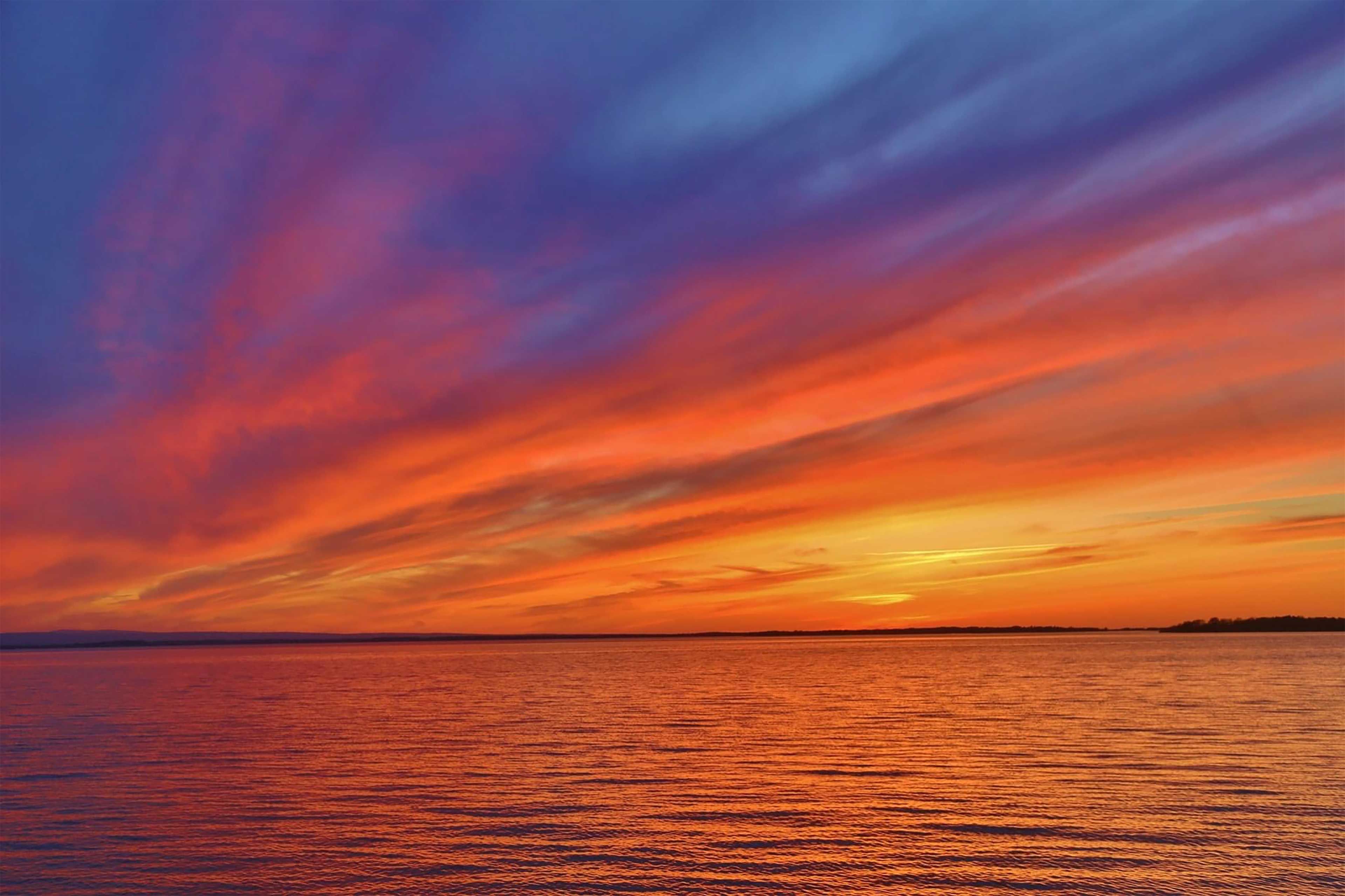 Sunset Over Waterfront Yard