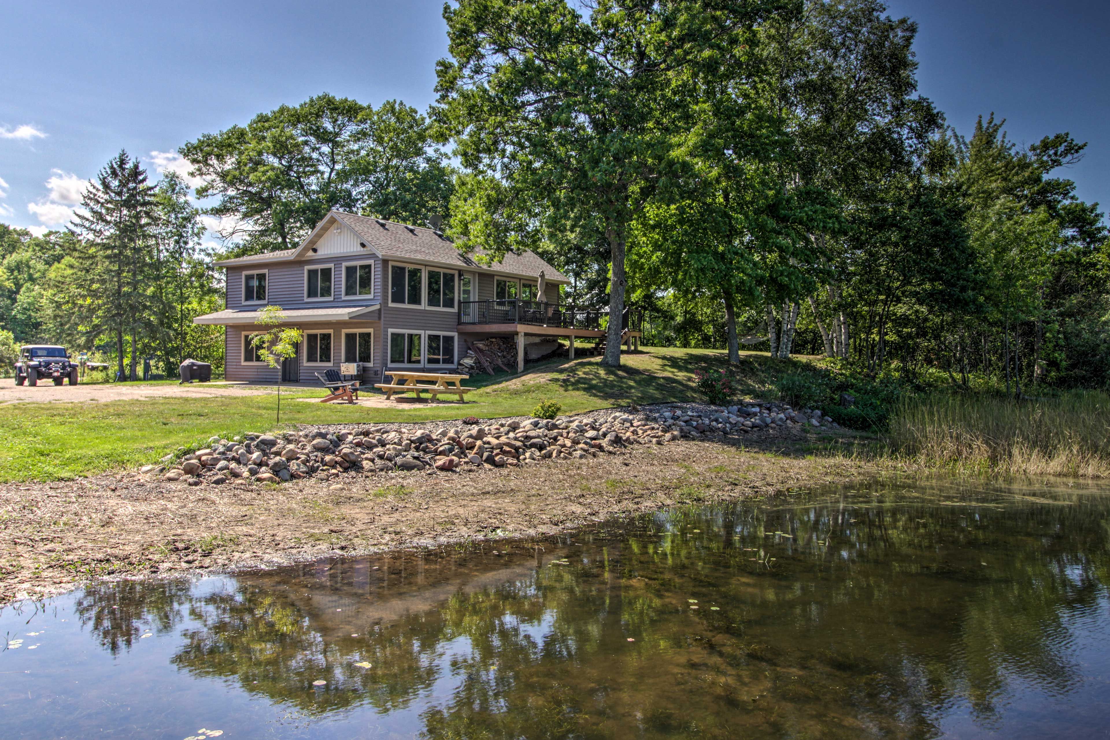 House Exterior | 248 Feet of Platte Lake Shoreline | Pet Friendly w/ Fee
