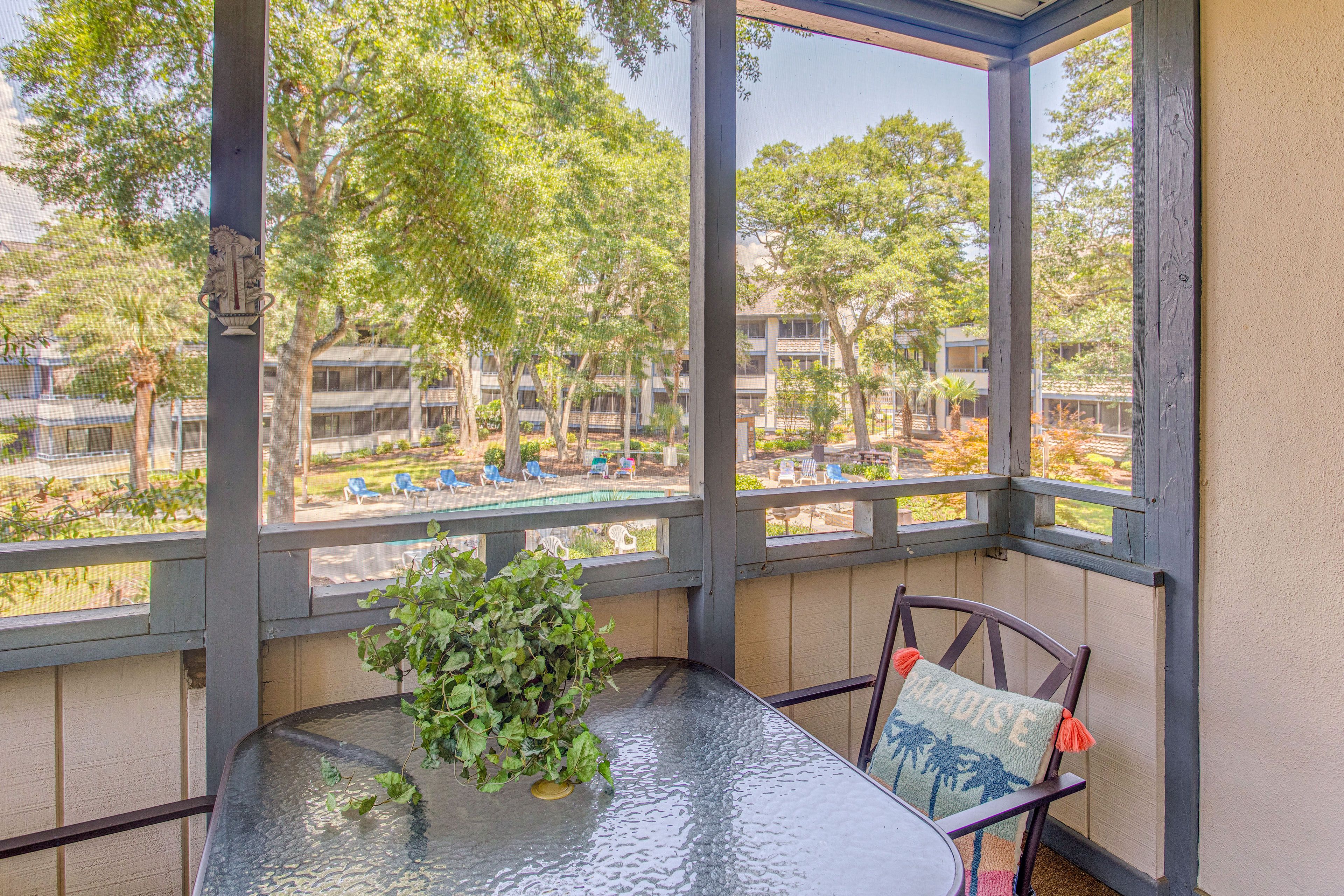 Screened Balcony | Outdoor Dining Table | Pool View