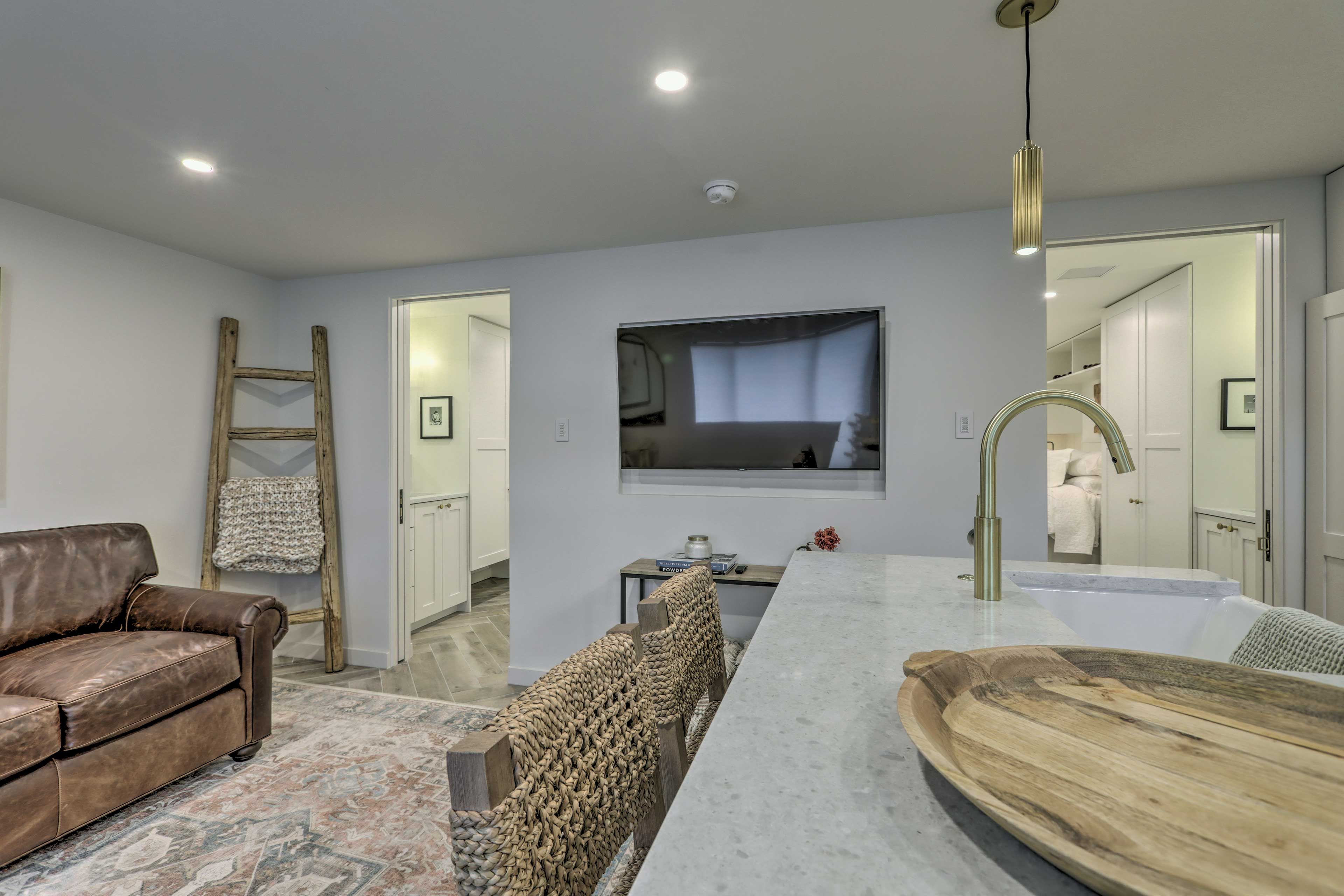 Living Area & Kitchen | 2-Person Breakfast Bar | Dishware & Flatware Provided