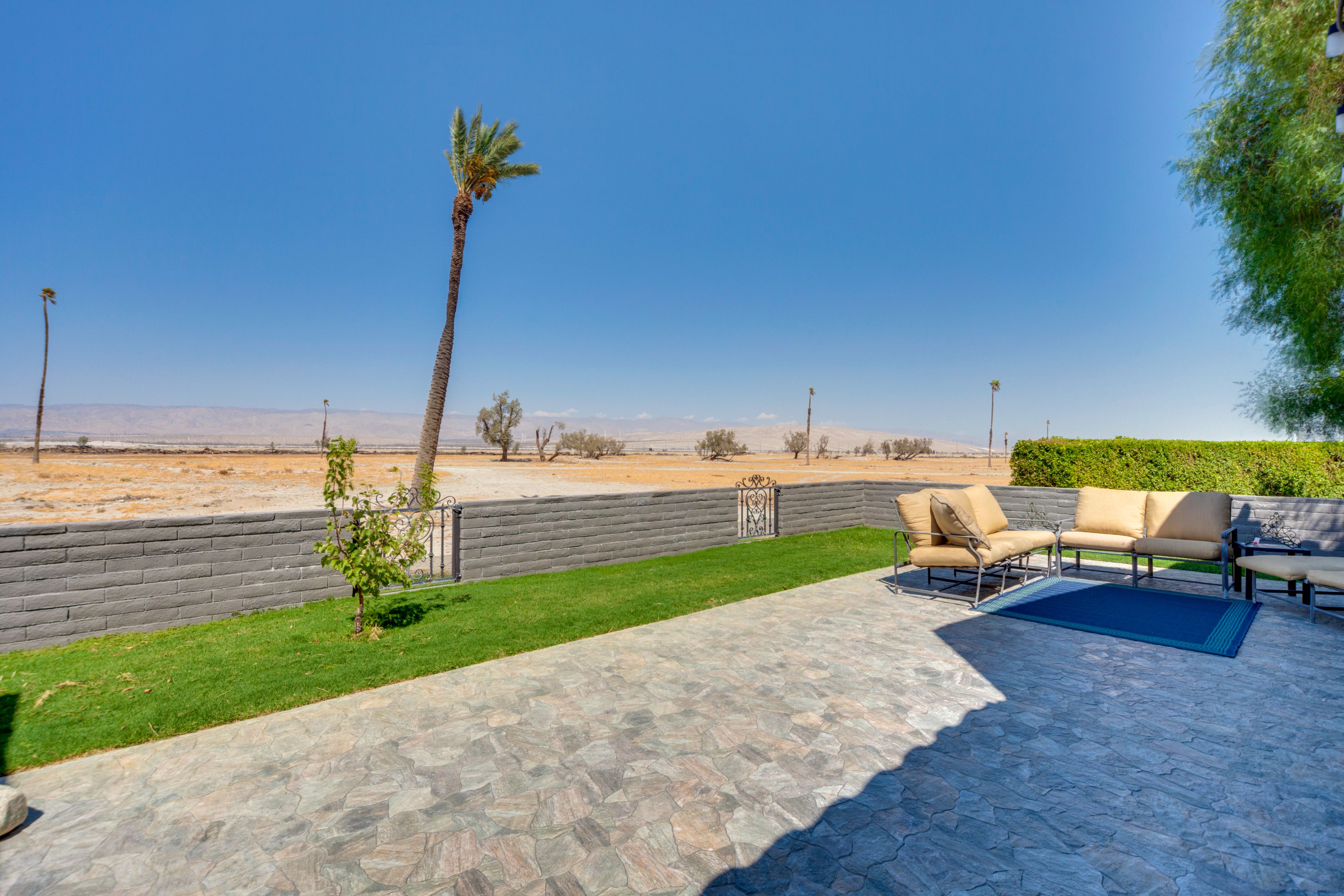 Fenced Backyard | Spacious Patio w/ Seating | Mountain Views