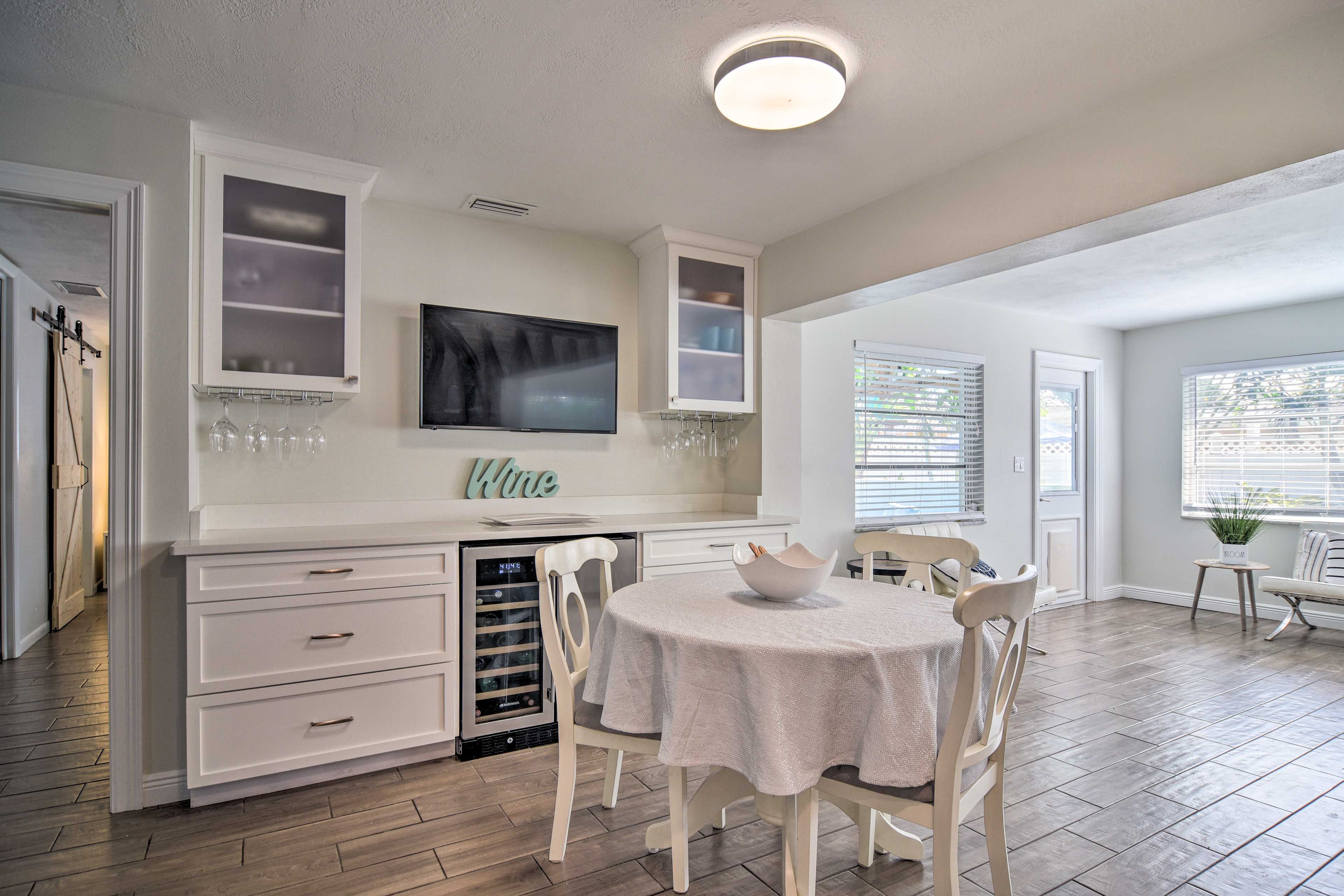 Dining Area | Dry Bar w/ Wine Cooler | Smart TV w/ Cable | Bedroom 1 on Left