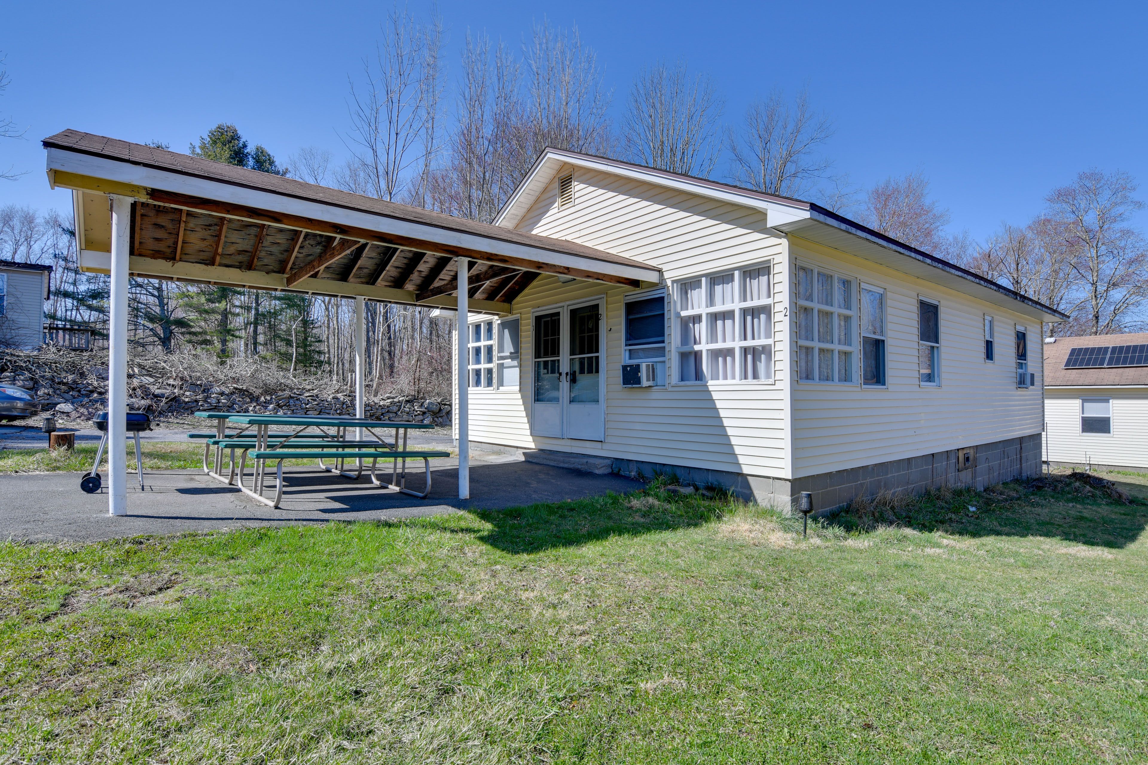 Duplex Exterior | Shared Patio | Picnic Tables | Grill